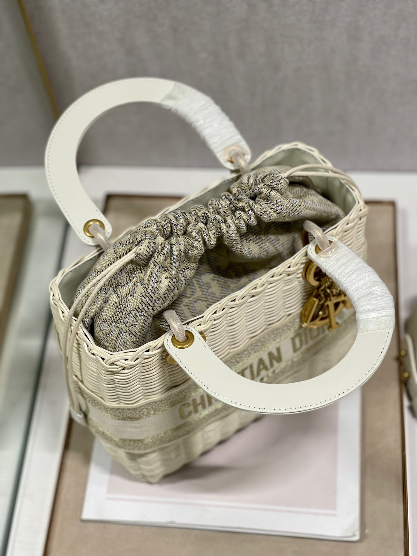 D*or medium lady D*or bag in wicker and white oblique jacquard