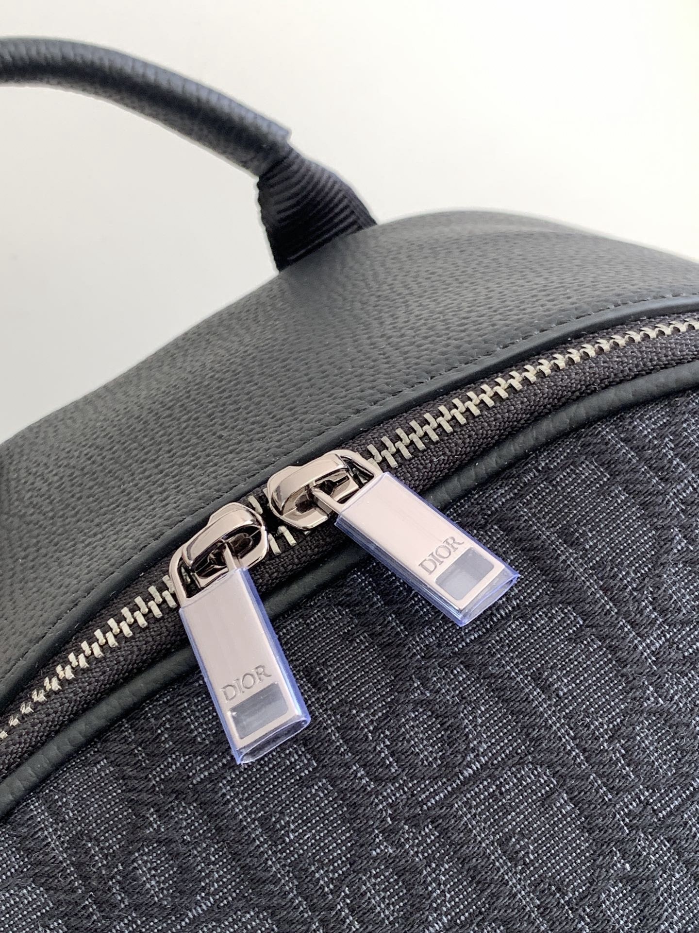 D*or saddle zip backpack in black oblique jacquard