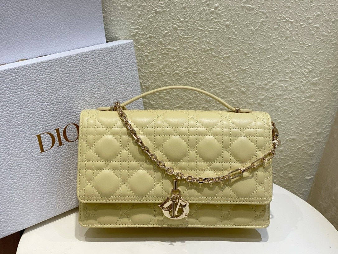 D*or miss D*or top handle bag in pastel yellow cannage lambskin