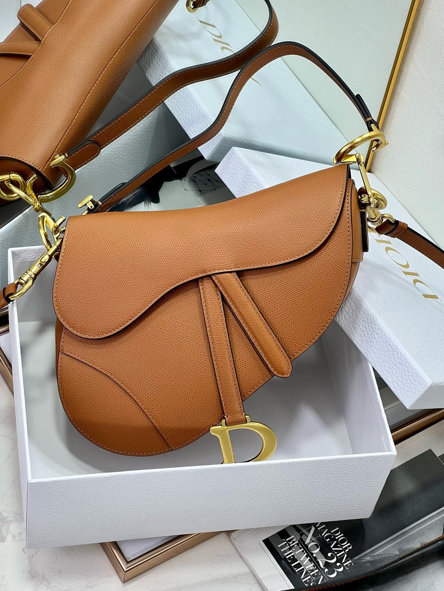 D*or saddle bag with strap in brown grained calfskin