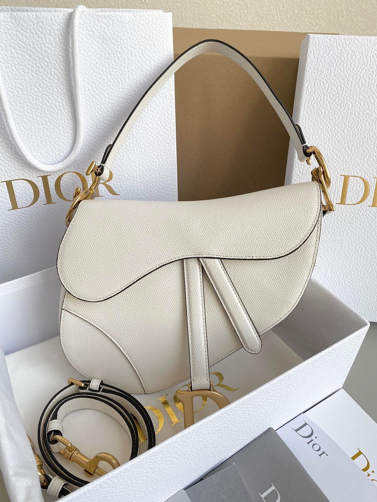 D*or saddle bag with strap in white grained calfskin