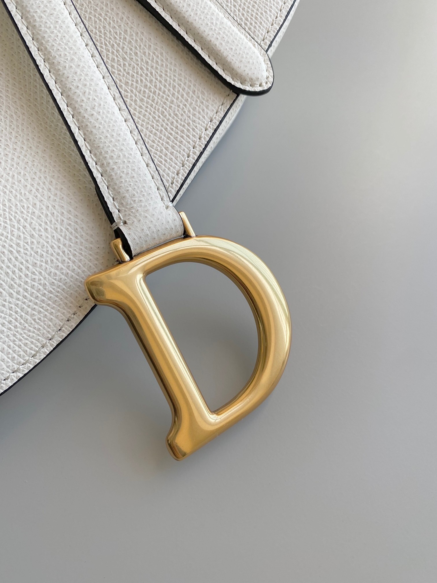 D*or saddle bag with strap in white grained calfskin