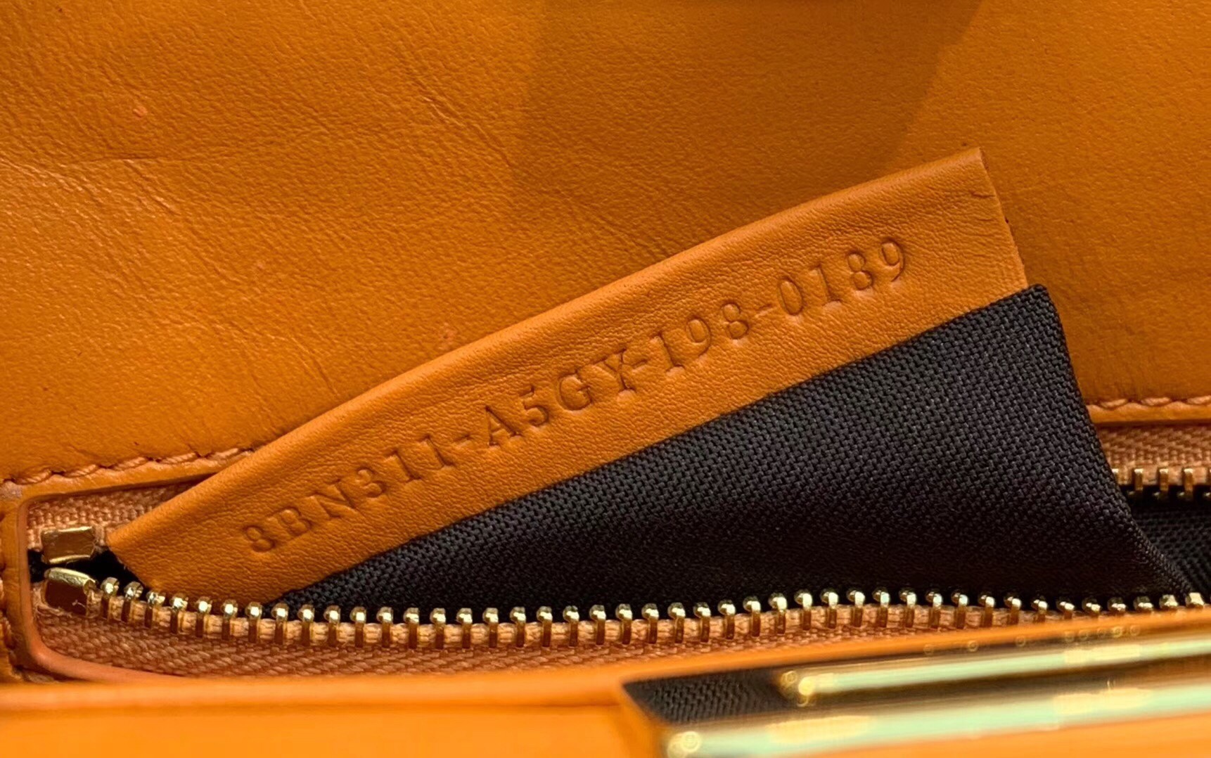 F**di peekaboo mini pocket bag in orange calfskin