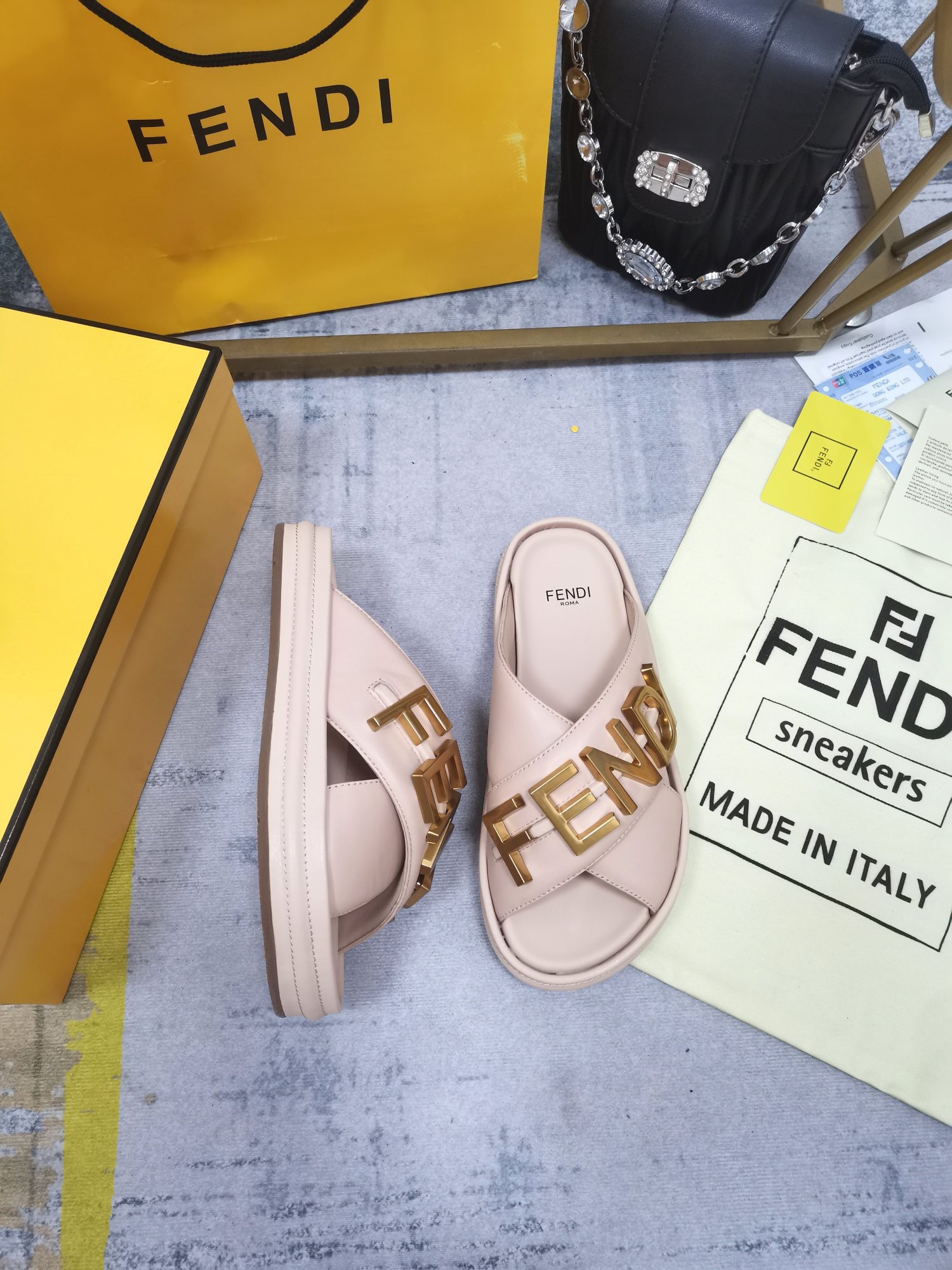 F**di F**digraphy slides in pink calfskin