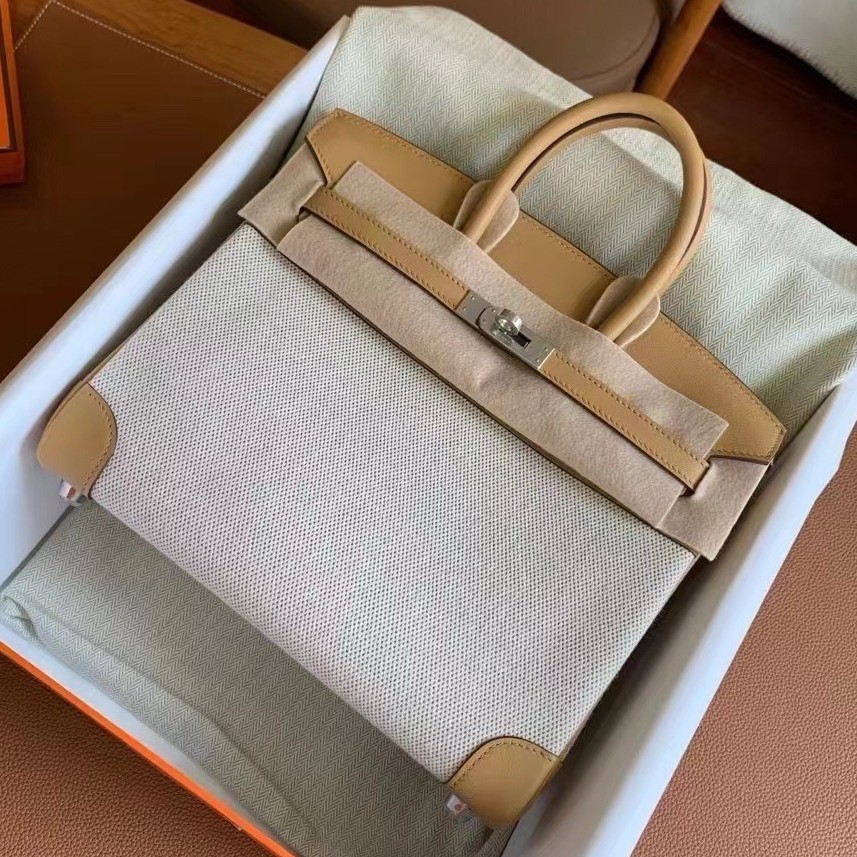 H**mes birkin 25 handmade bag in toile & biscuit swift leather