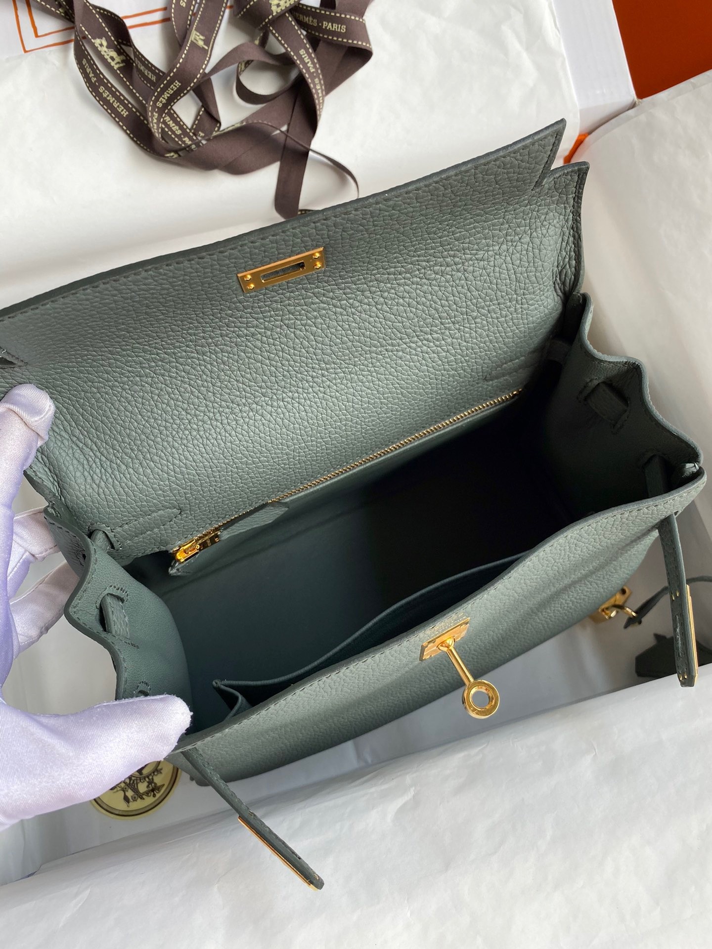 H**mes kelly retourne 25 handmade bag in vert amande clemence leather