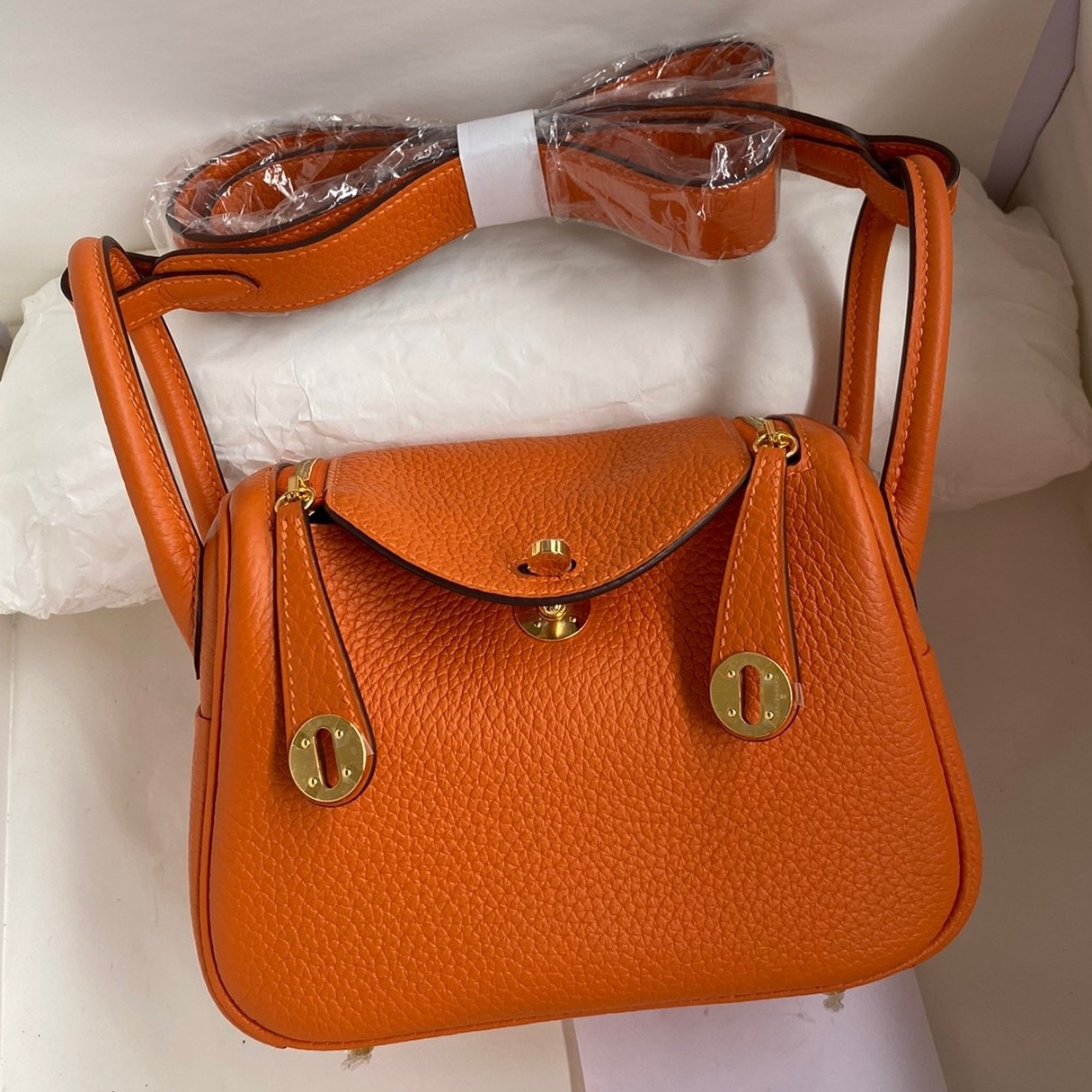 H**mes mini lindy handmade bag in orange clemence leather