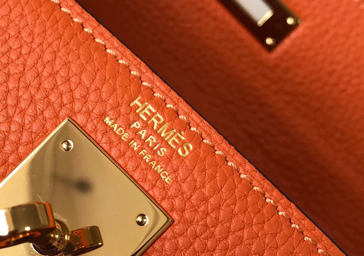 H**mes kelly 28cm retourne bag in orange clemence leather
