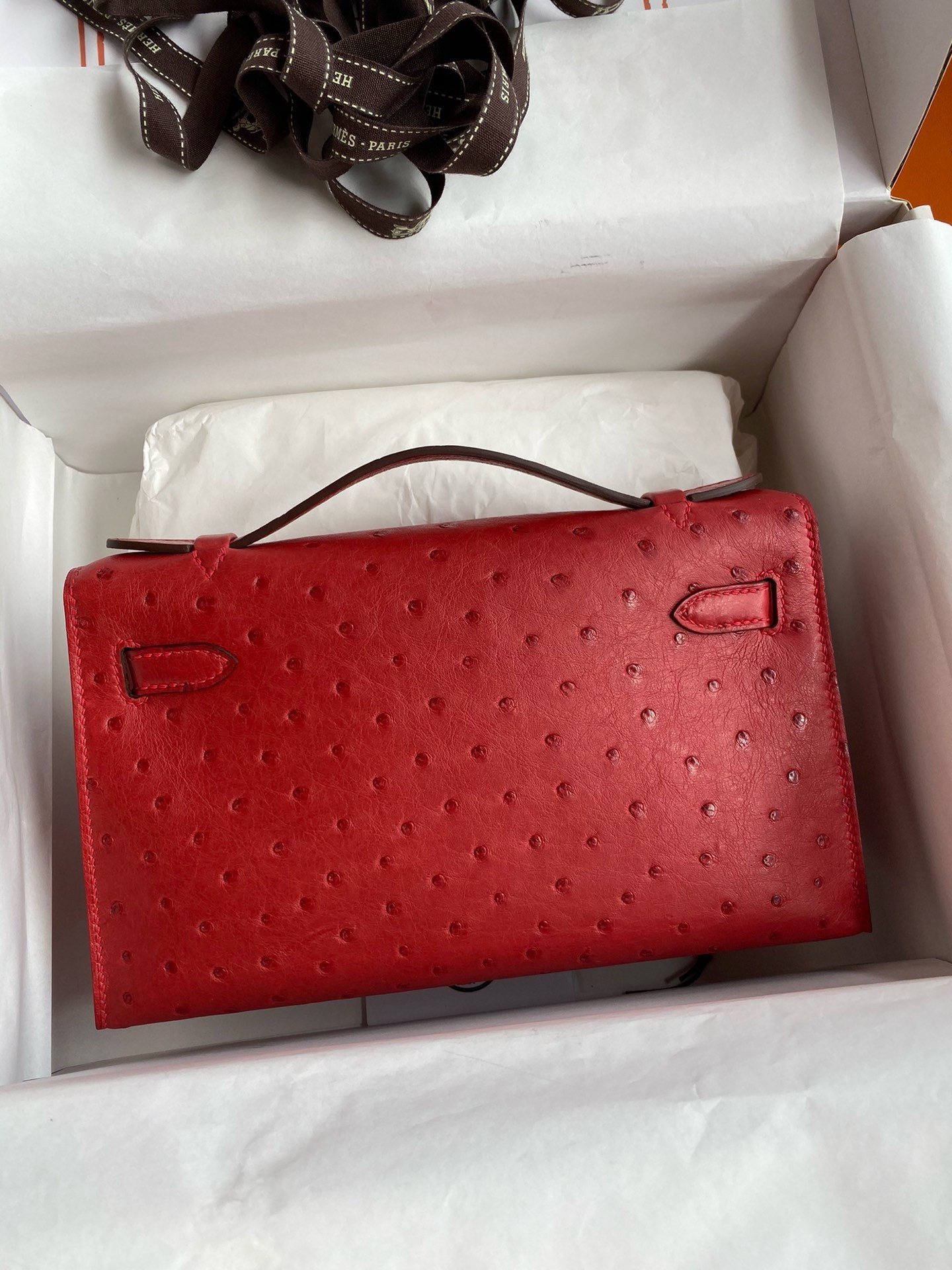 H**mes kelly pochette handmade bag in red ostrich leather
