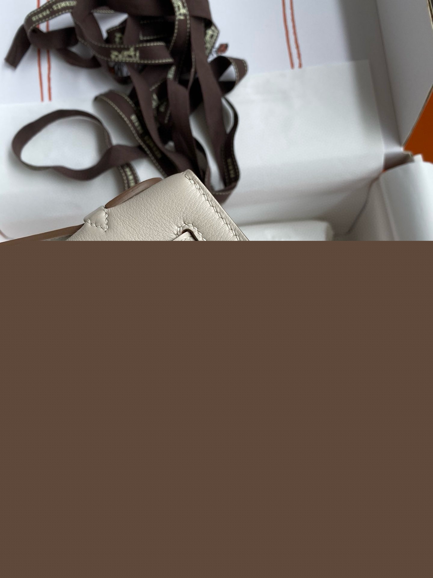 H**mes kelly pochette handmade bag in craie swift calfskin