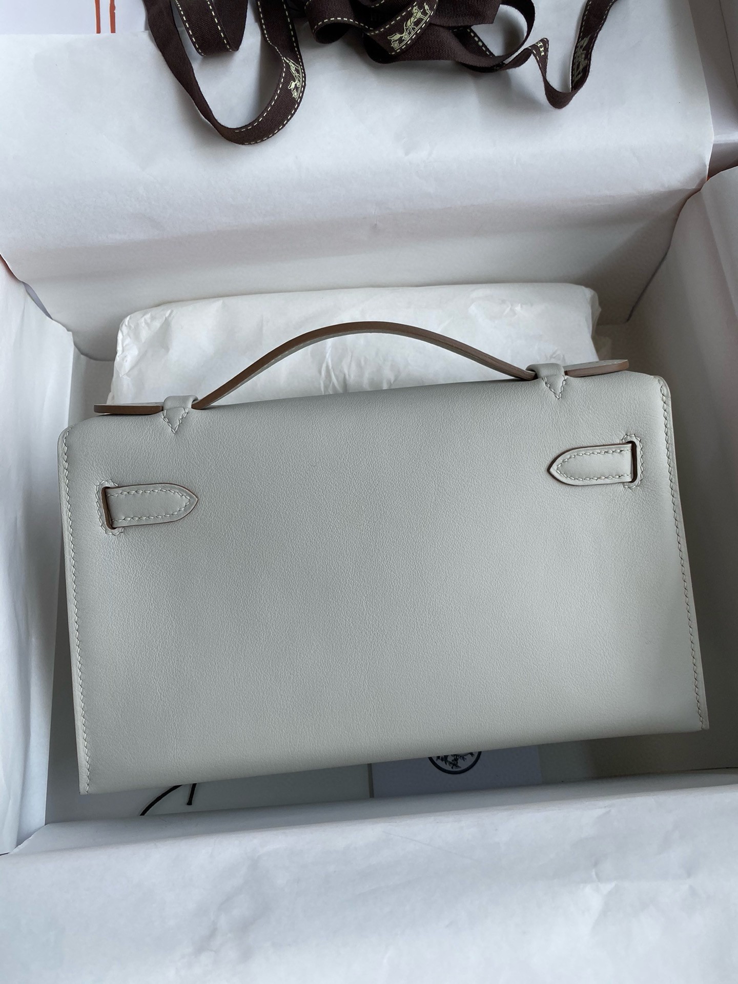 H**mes kelly pochette handmade bag in pearl grey swift calfskin