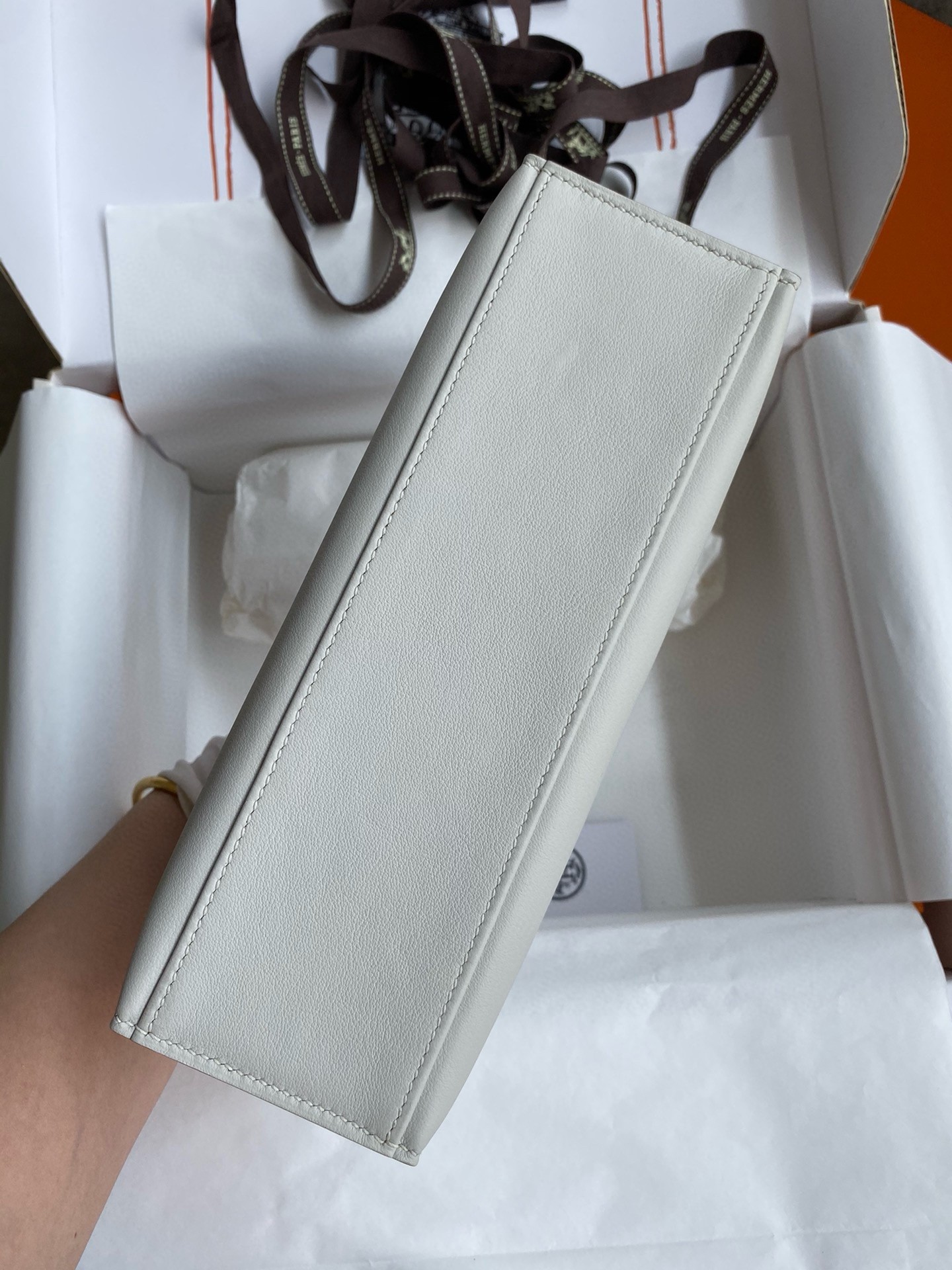 H**mes kelly pochette handmade bag in pearl grey swift calfskin