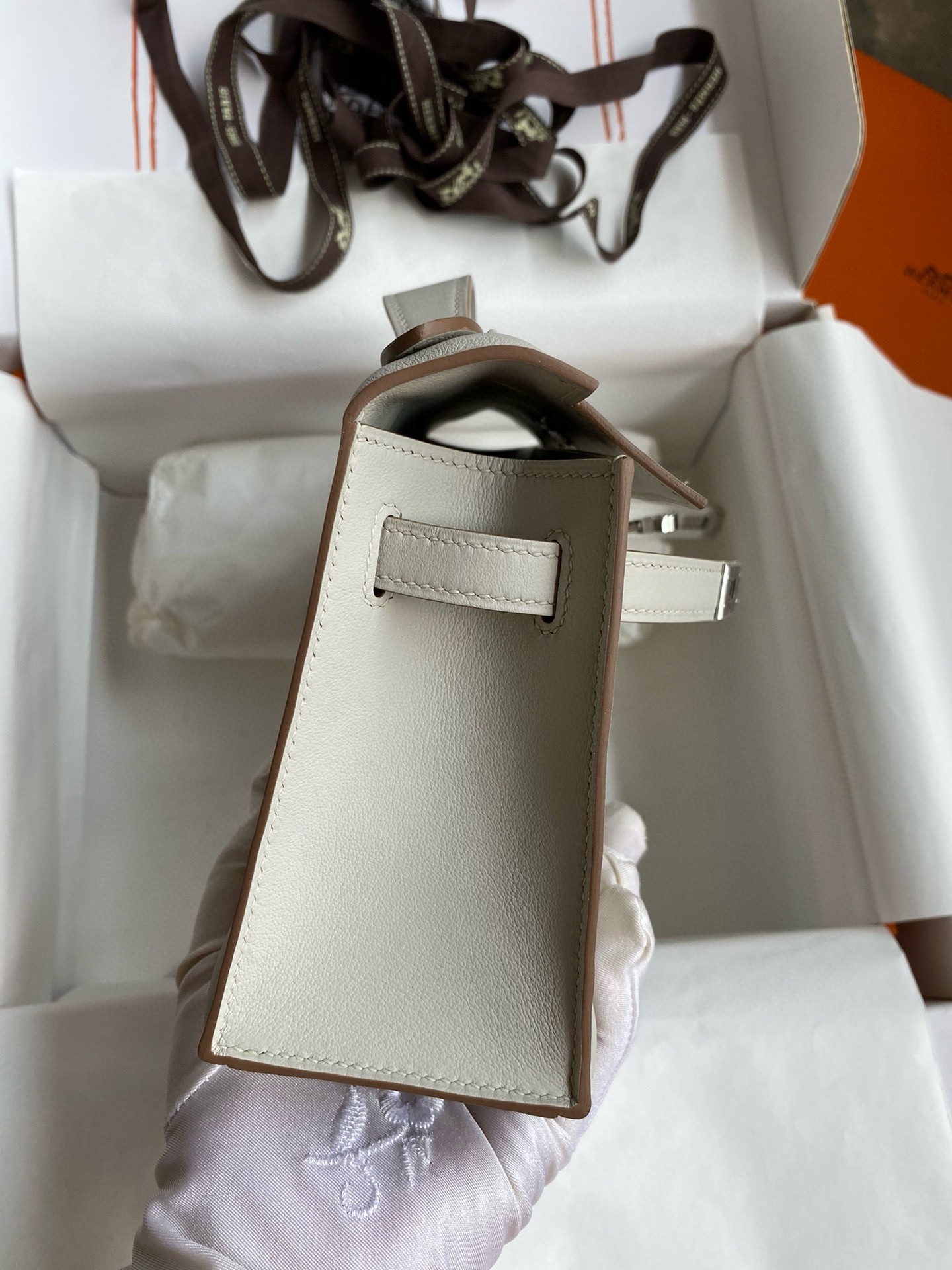 H**mes kelly pochette handmade bag in pearl grey swift calfskin