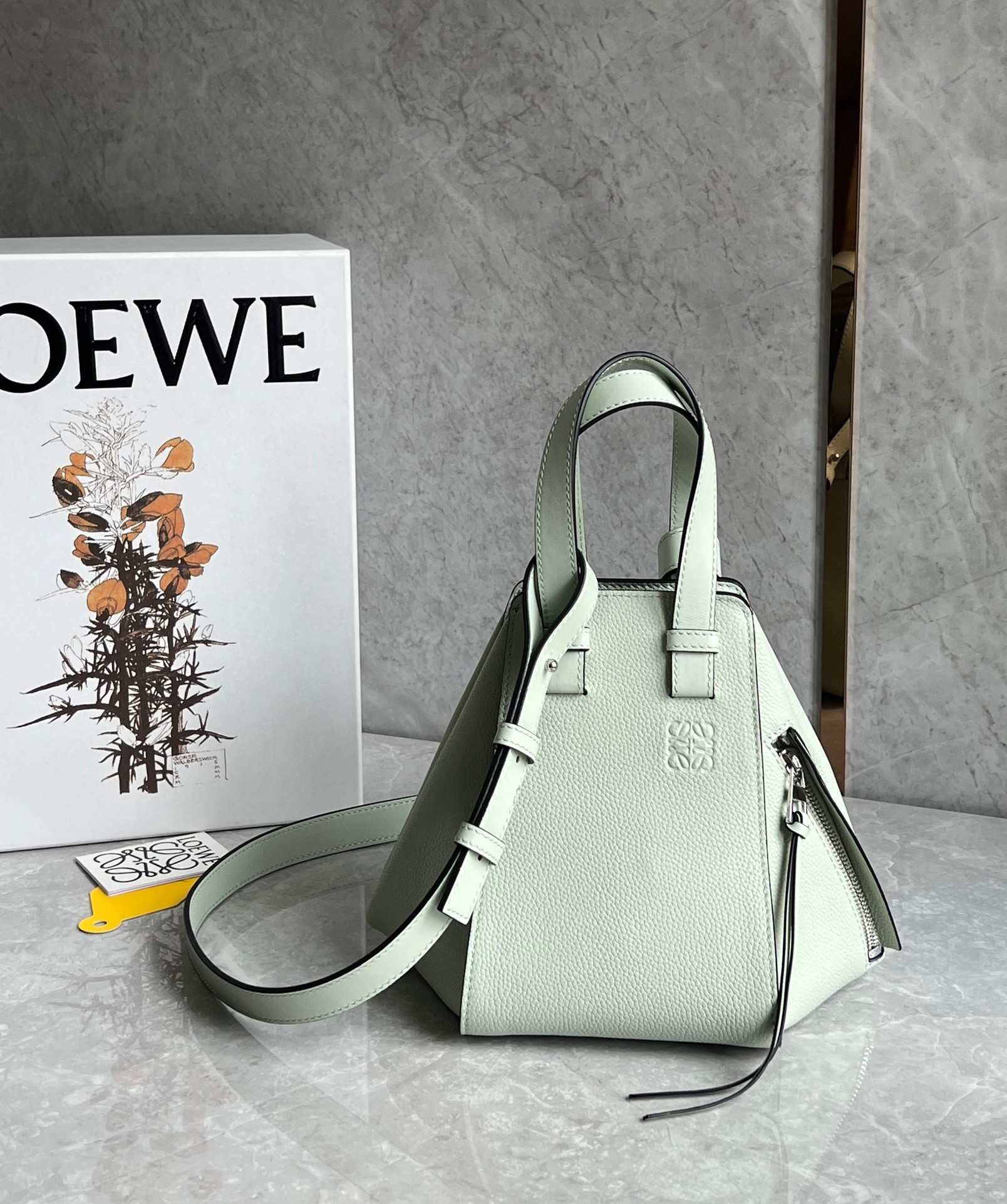 L0ew* compact hammock bag in light celadon grained calfskin