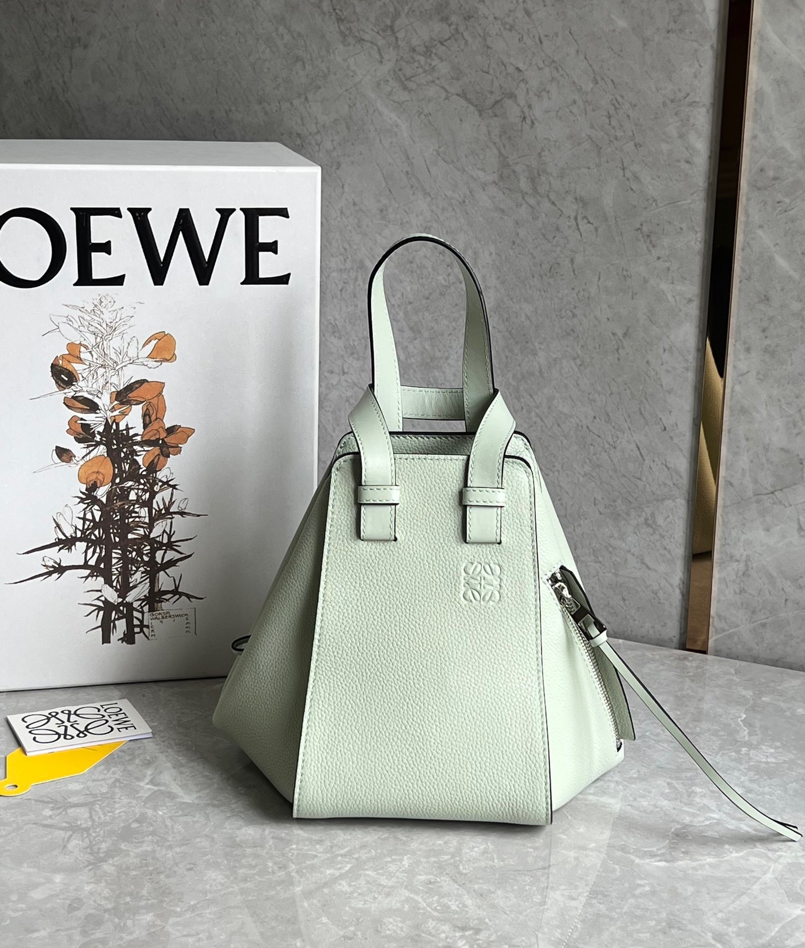 L0ew* compact hammock bag in light celadon grained calfskin