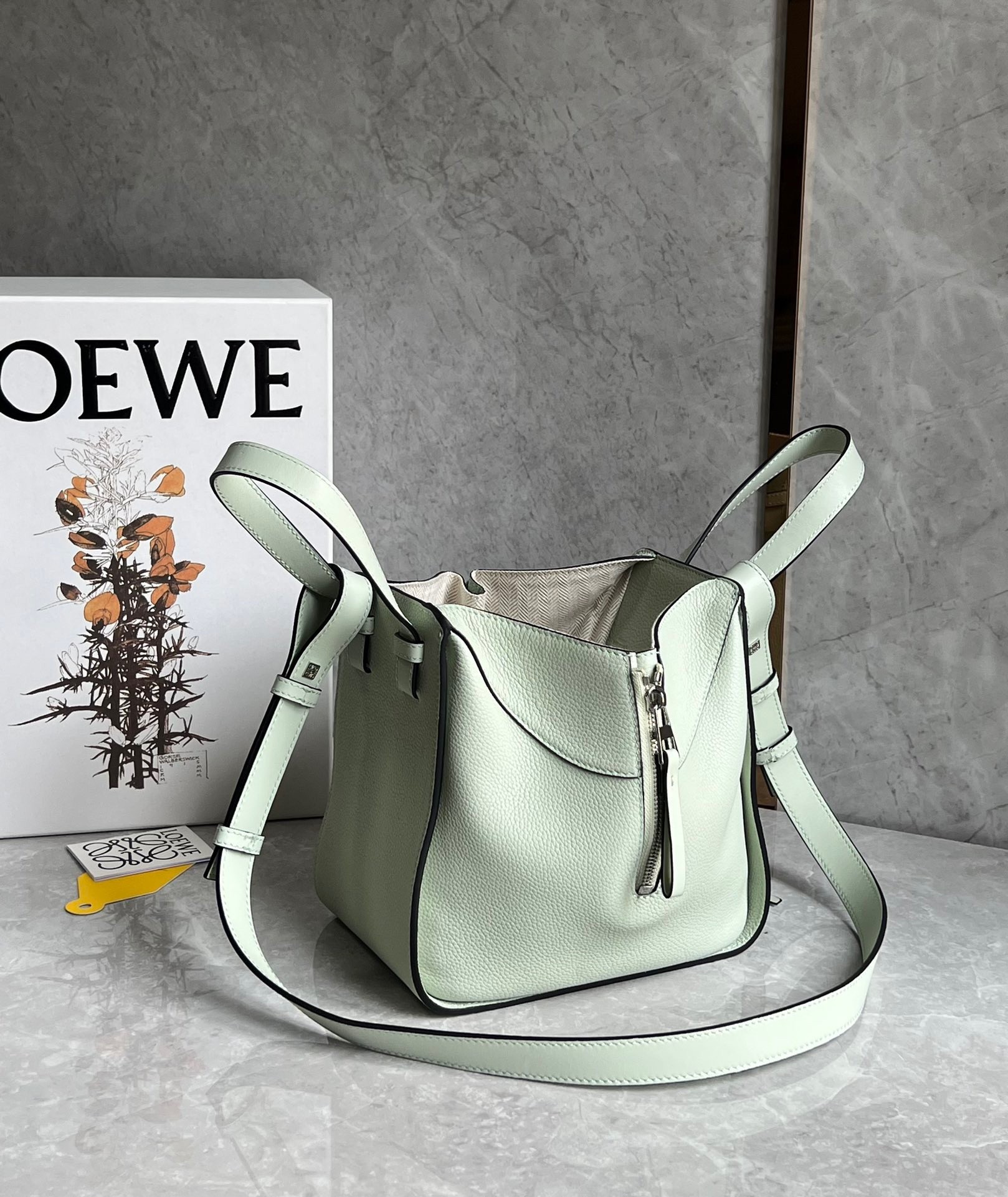 L0ew* compact hammock bag in light celadon grained calfskin