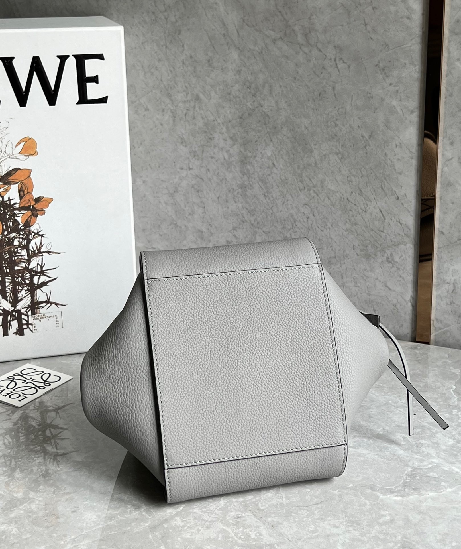 L0ew* compact hammock bag in pearl grey grained calfskin