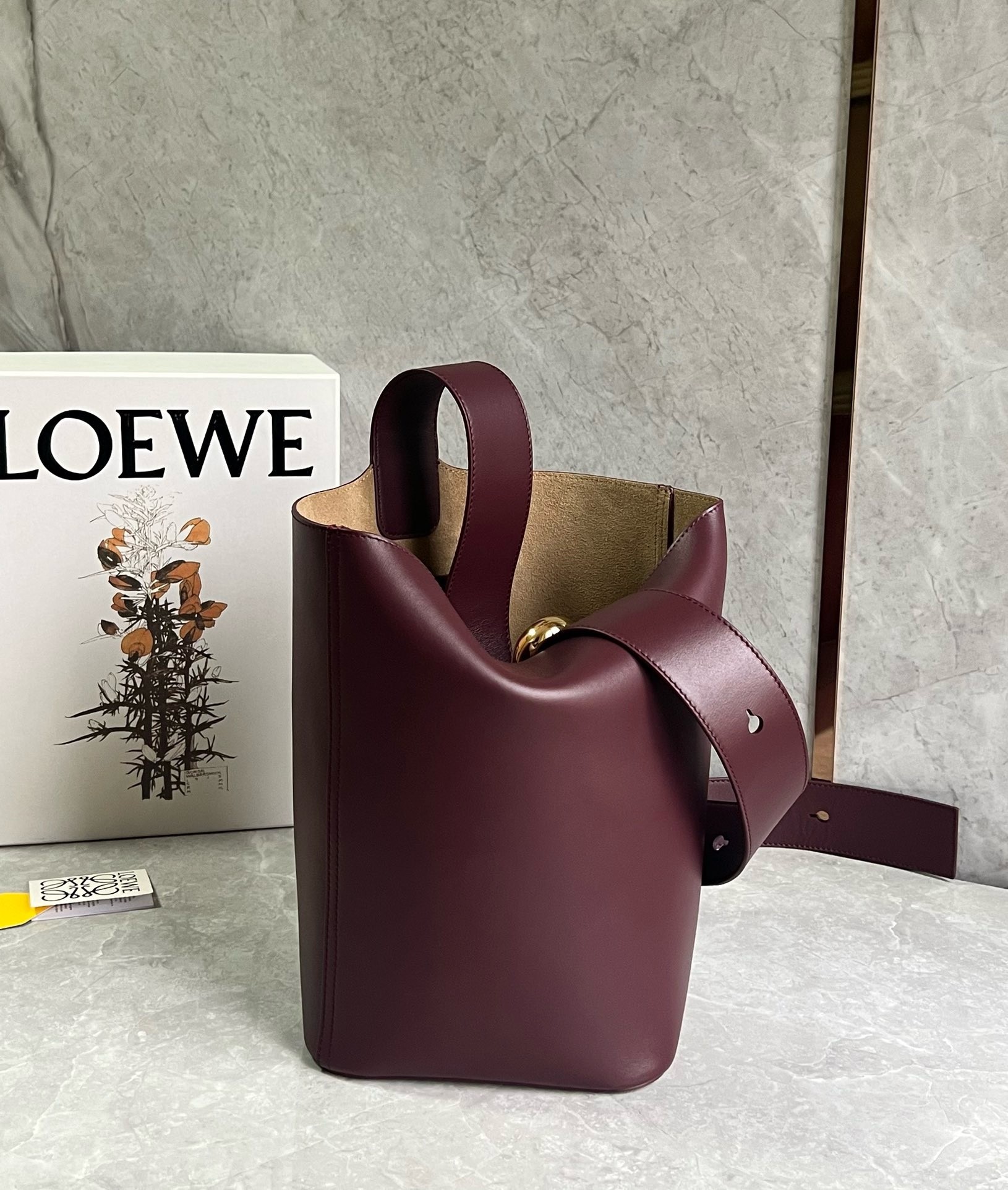 L0ew* medium pebble bucket bag in burgundy calfskin