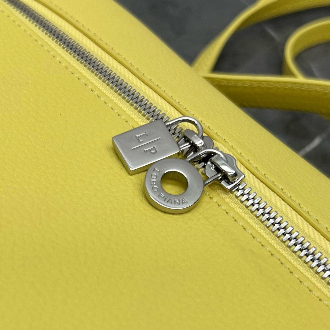 L**o p*ana extra pocket pouch l27 in yellow grained leather