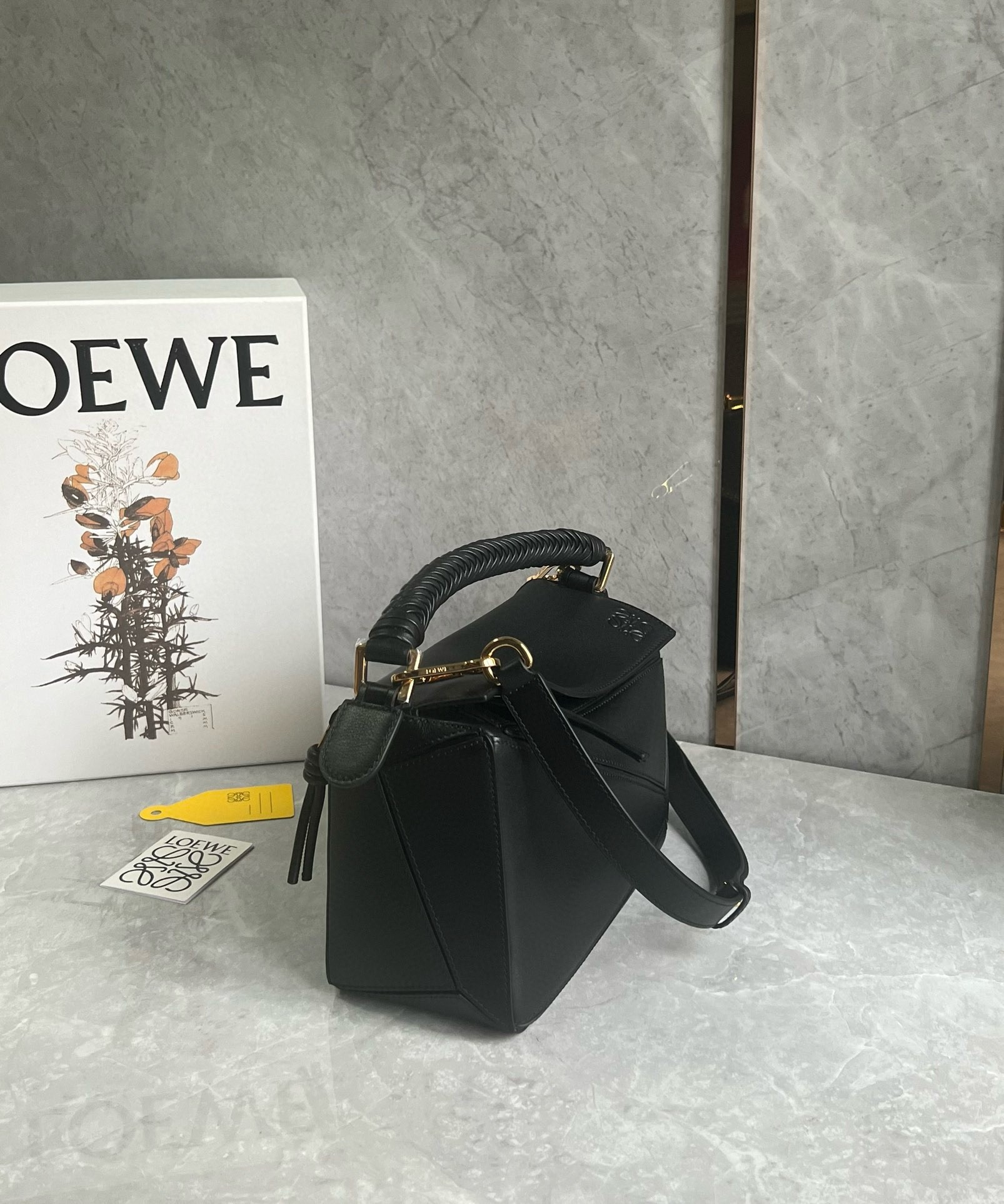 L0ew* puzzle small bag in black calfskin with woven handle