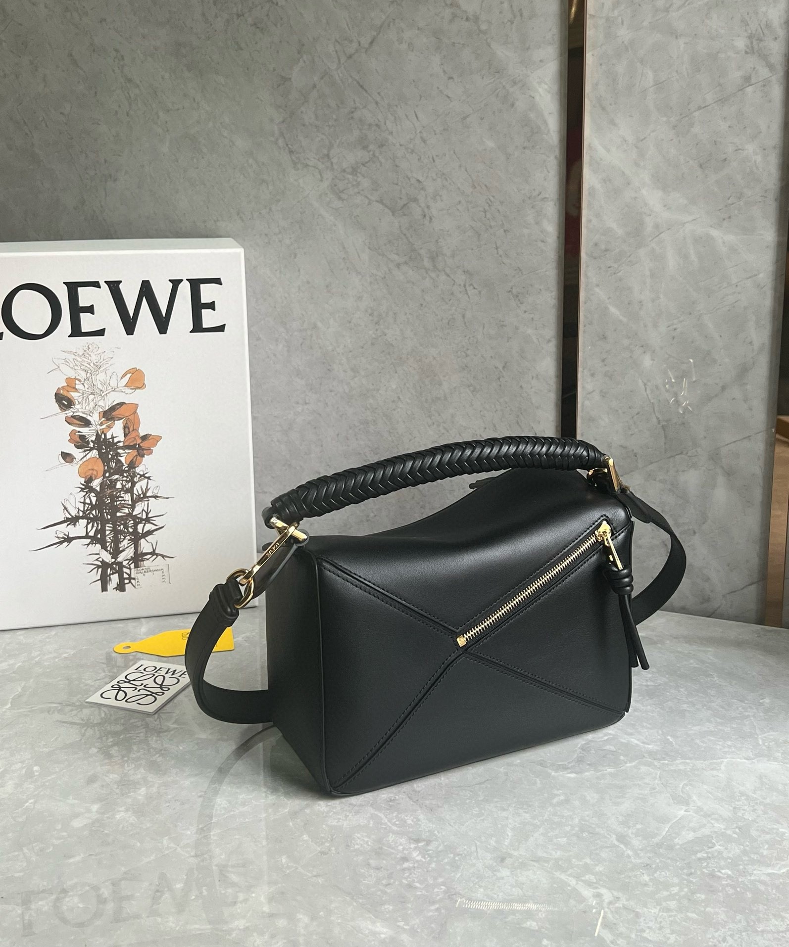 L0ew* puzzle small bag in black calfskin with woven handle