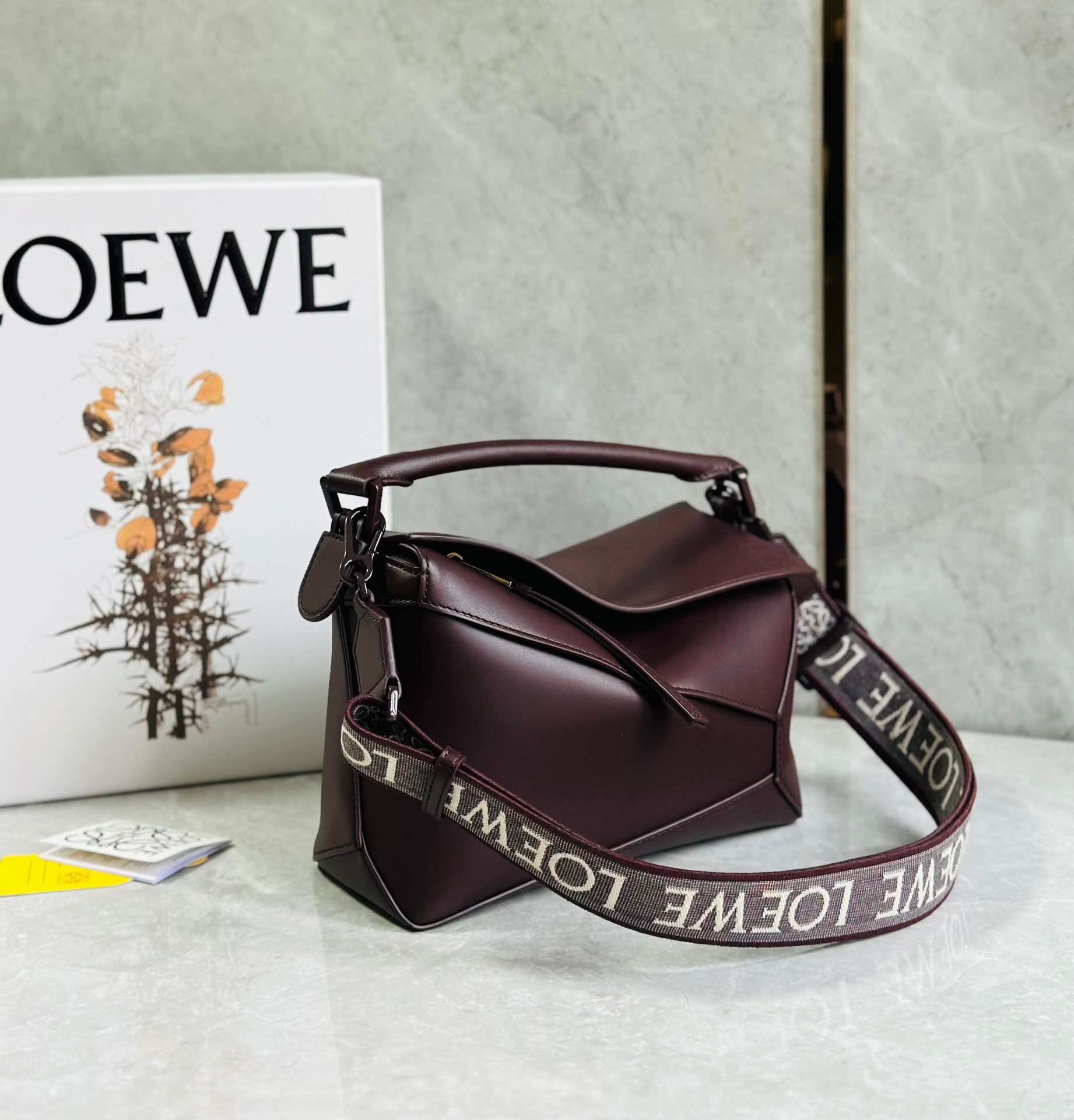 L0ew* puzzle small bag in burgundy satin calfskin
