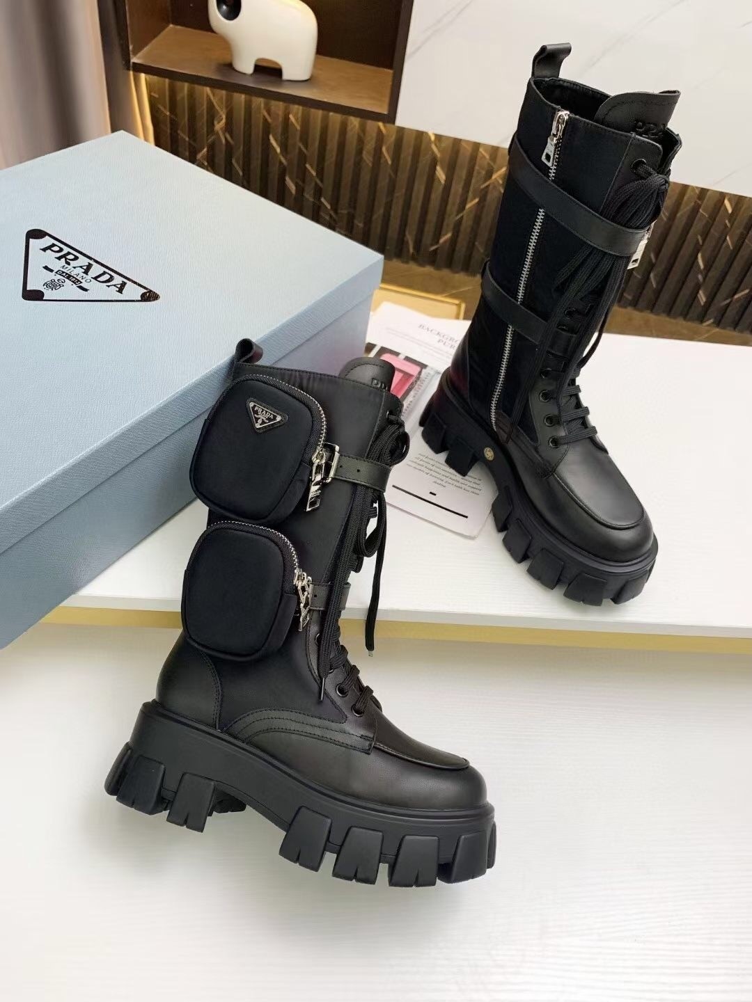 Pra*a monolith boots in noir leather and nylon fabric