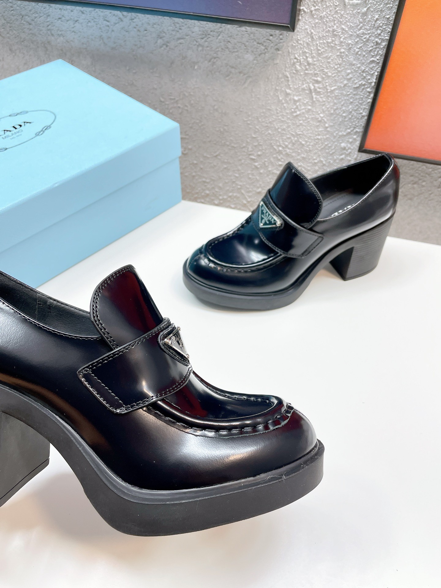 Pra*a chocolate high-heeled loafers in black brushed leather