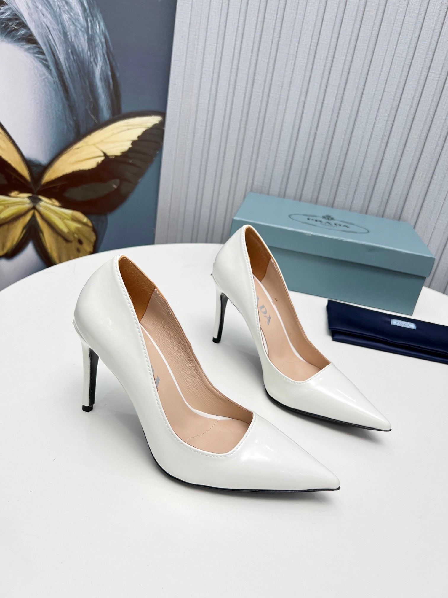 Pra*a pumps 95mm in white patent leather
