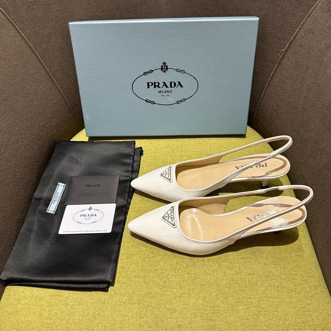 Pra*a slingback pumps 55mm in white patent leather