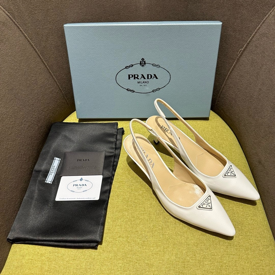 Pra*a slingback pumps 55mm in white patent leather