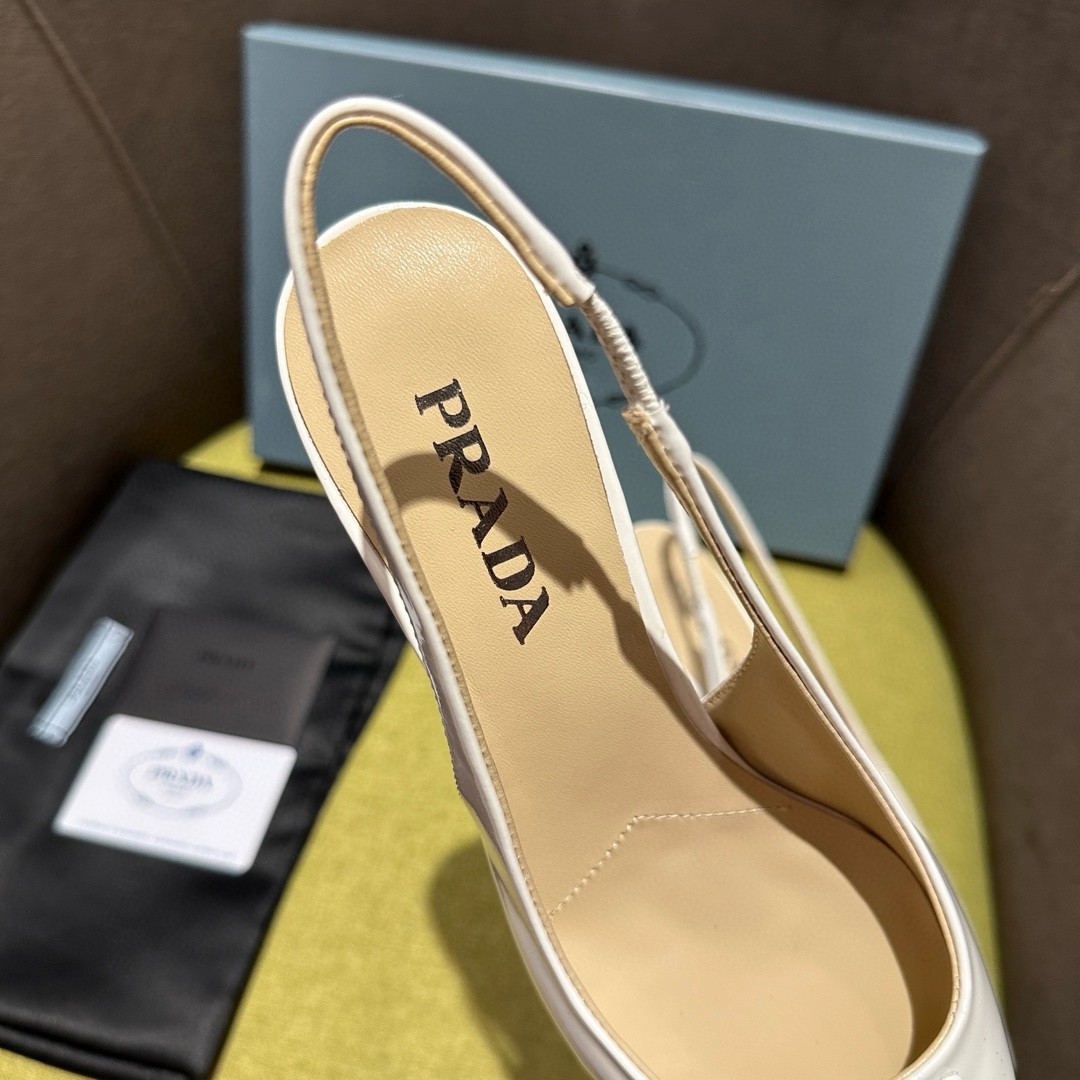 Pra*a slingback pumps 55mm in white patent leather