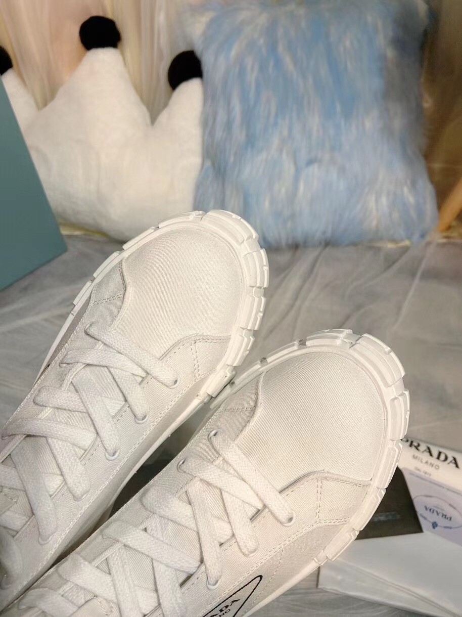 Pra*a white cotton canvas high-top sneakers