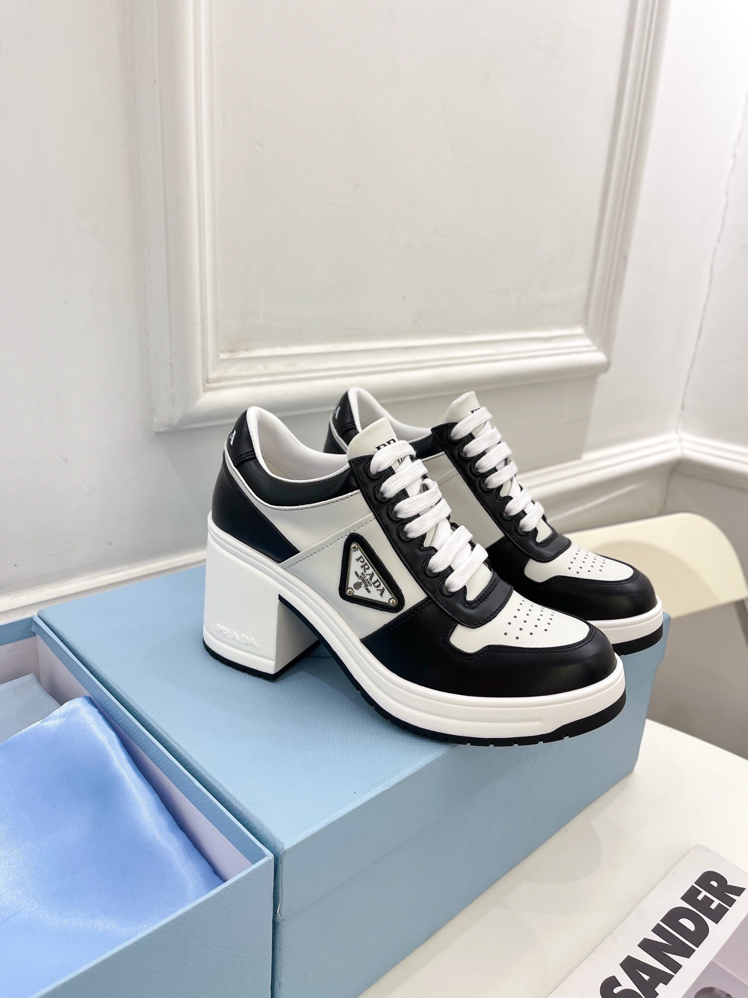 Pra*a downtown high-heeled sneakers in black and white leather