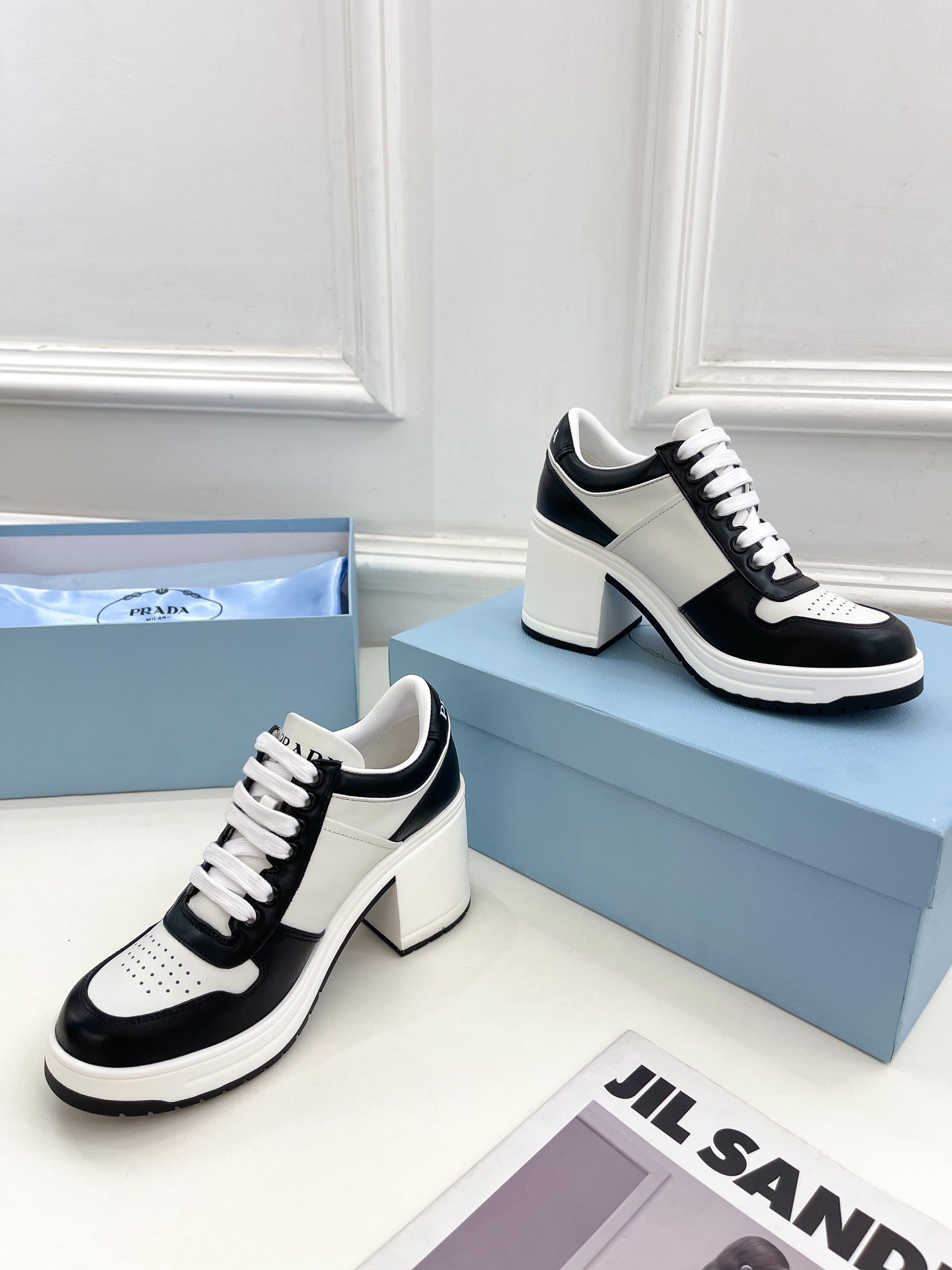 Pra*a downtown high-heeled sneakers in black and white leather