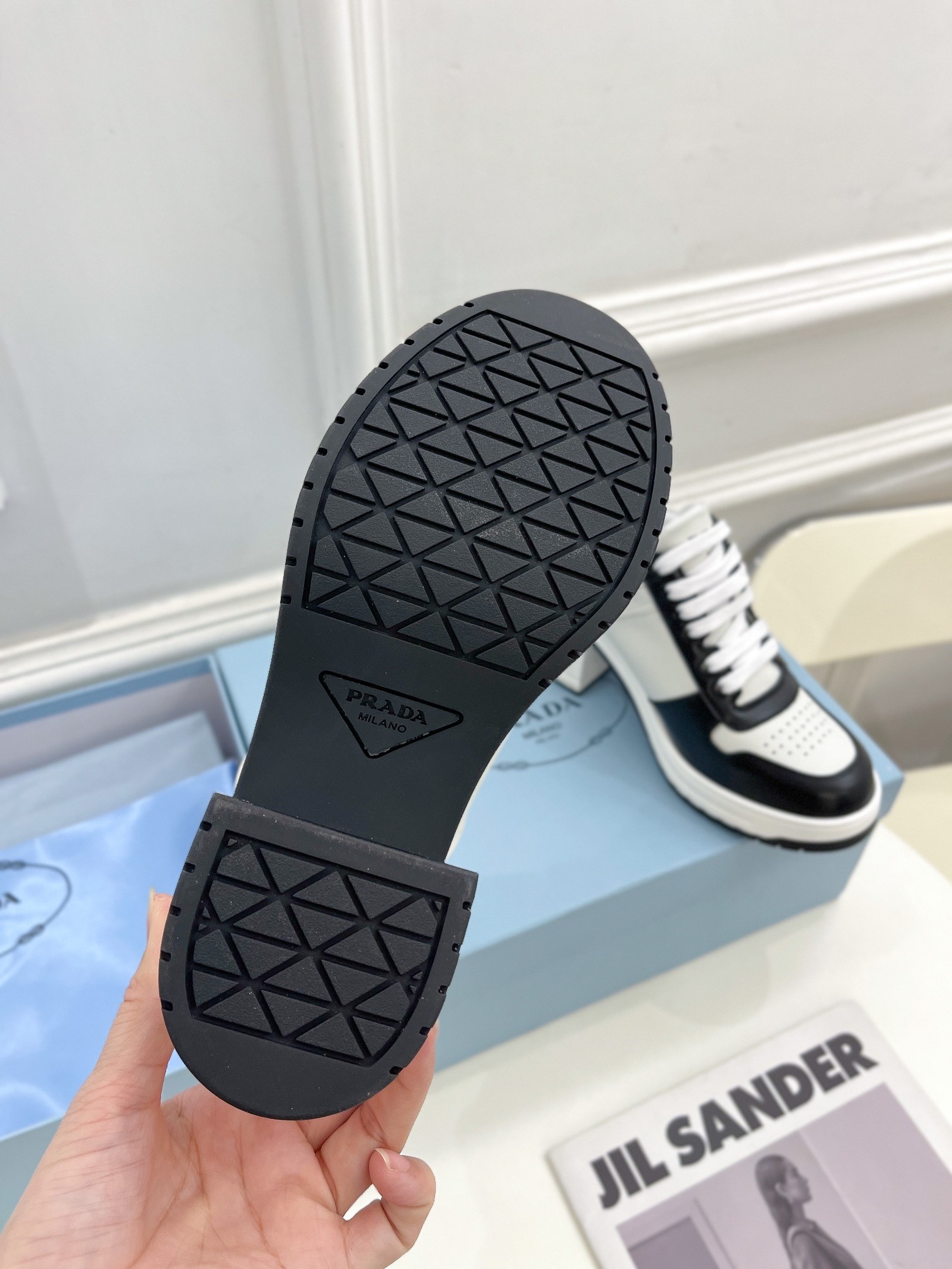 Pra*a downtown high-heeled sneakers in black and white leather