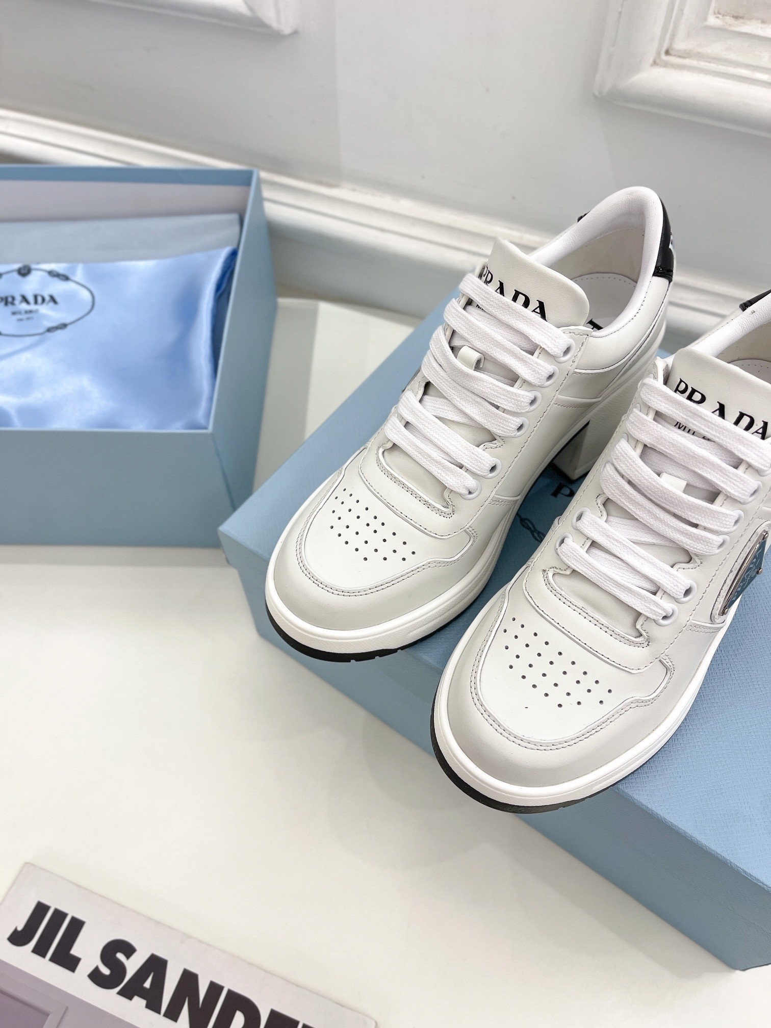 Pra*a downtown high-heeled sneakers in white leather