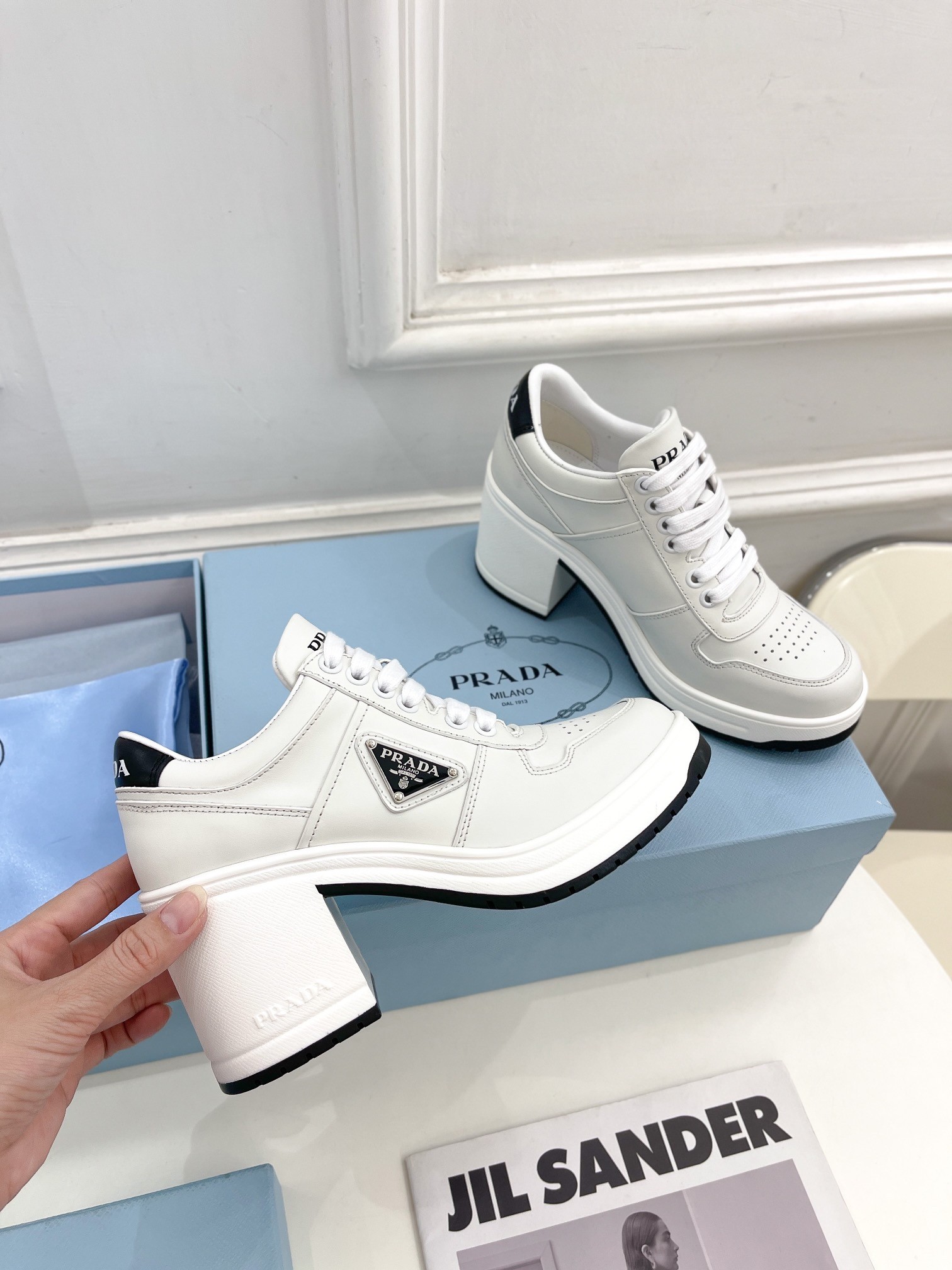 Pra*a downtown high-heeled sneakers in white leather