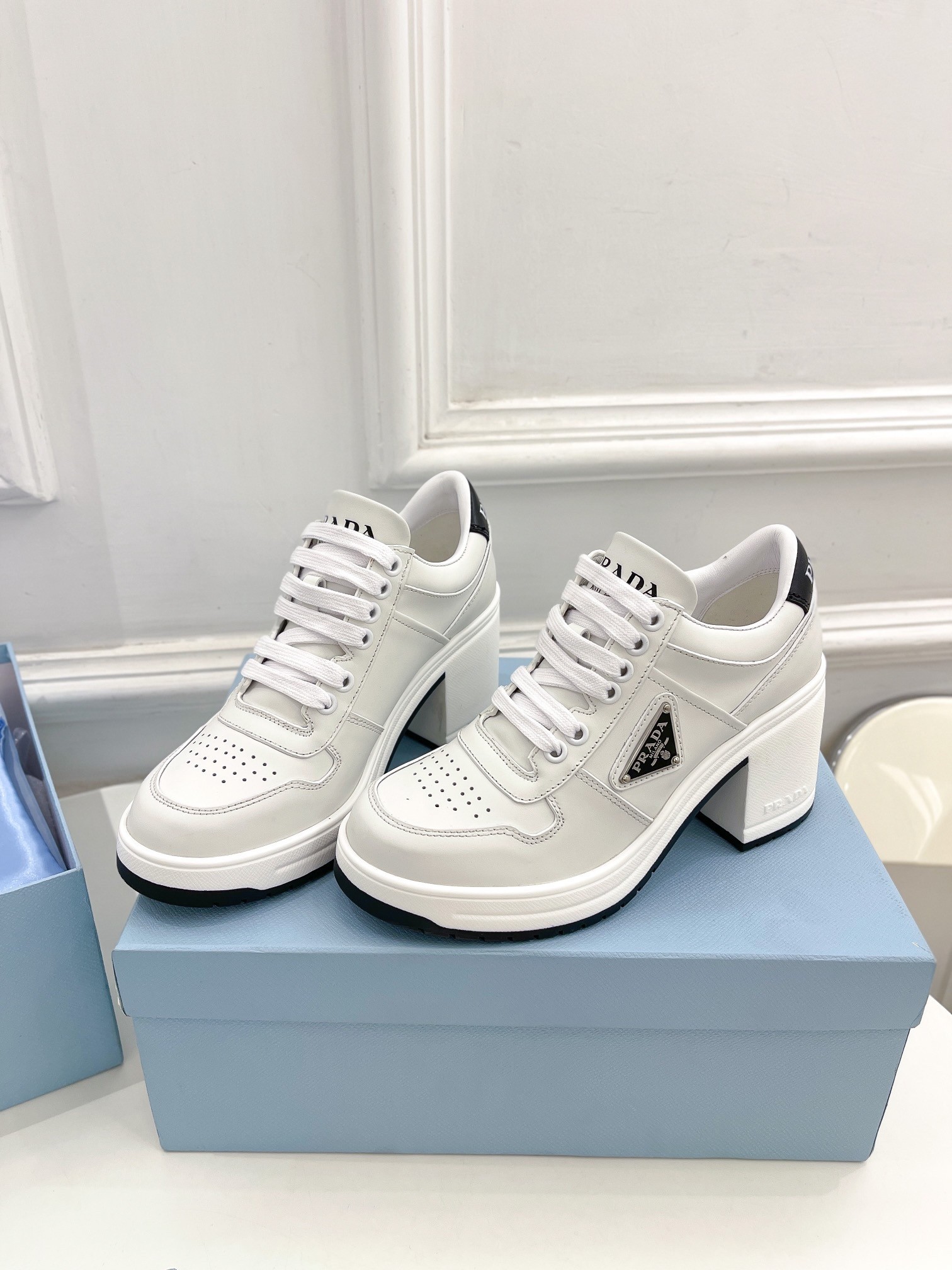 Pra*a downtown high-heeled sneakers in white leather