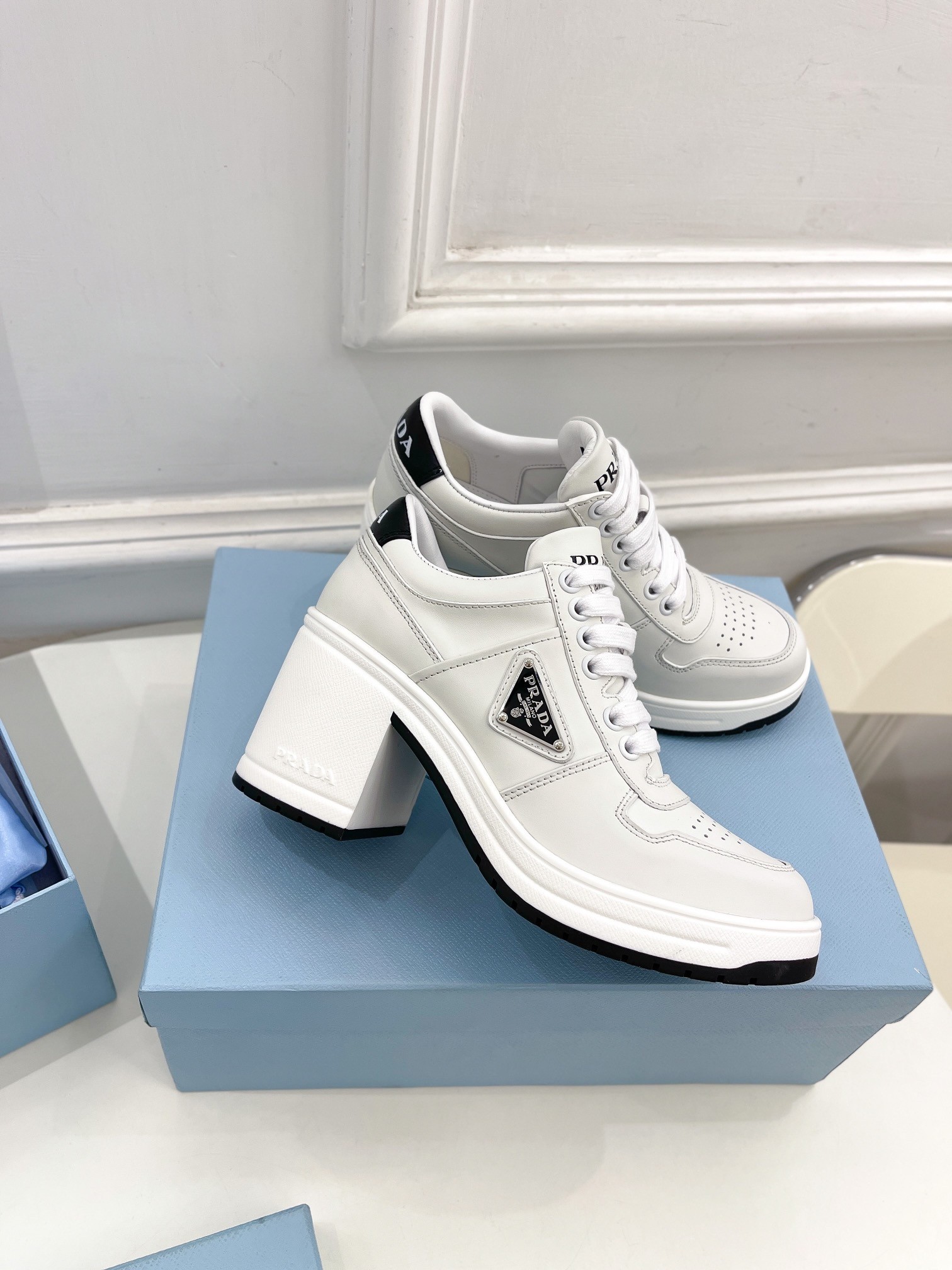 Pra*a downtown high-heeled sneakers in white leather