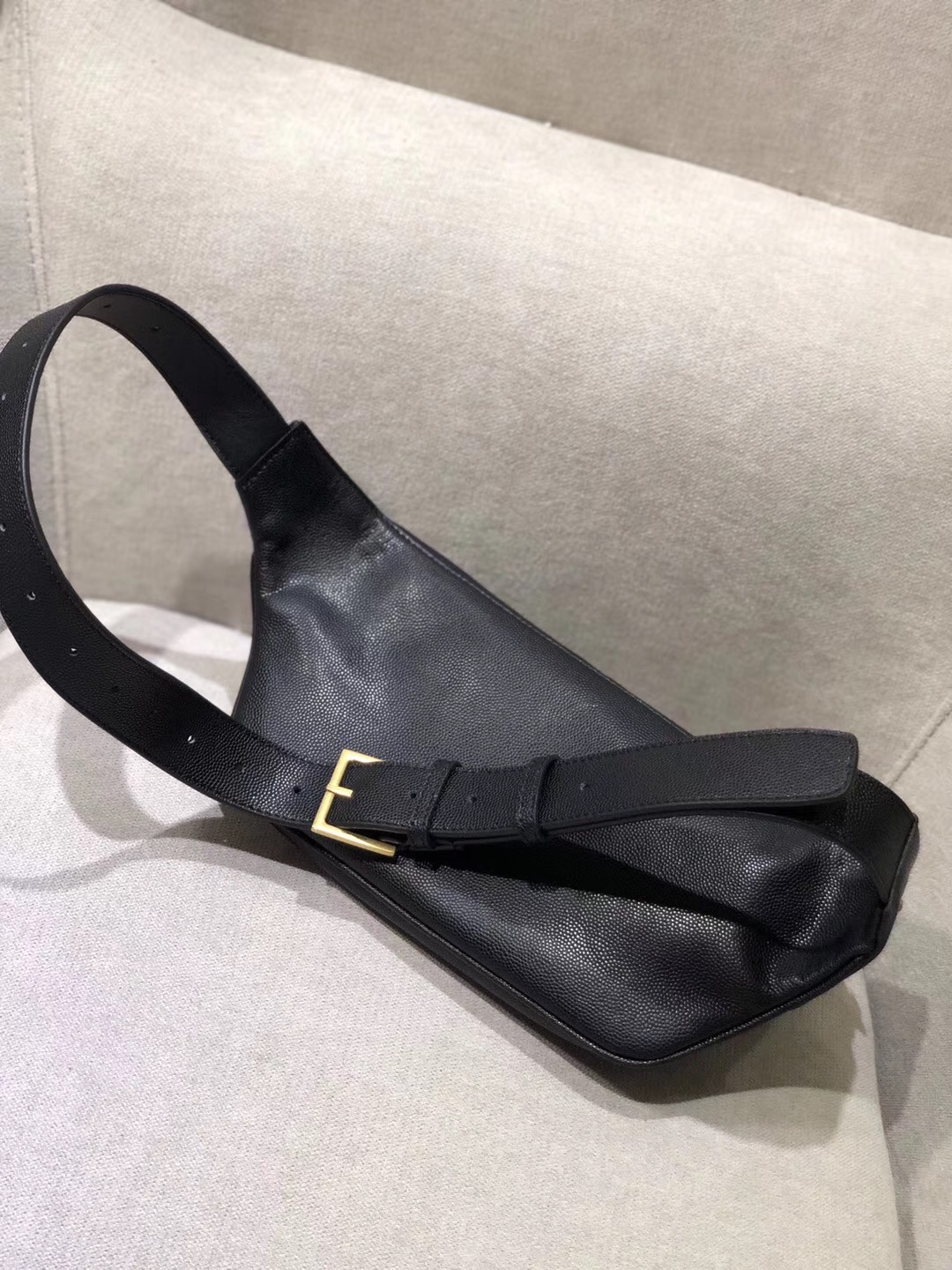 Sa**t Lau*nt classic monogram belt bag in black grained leather