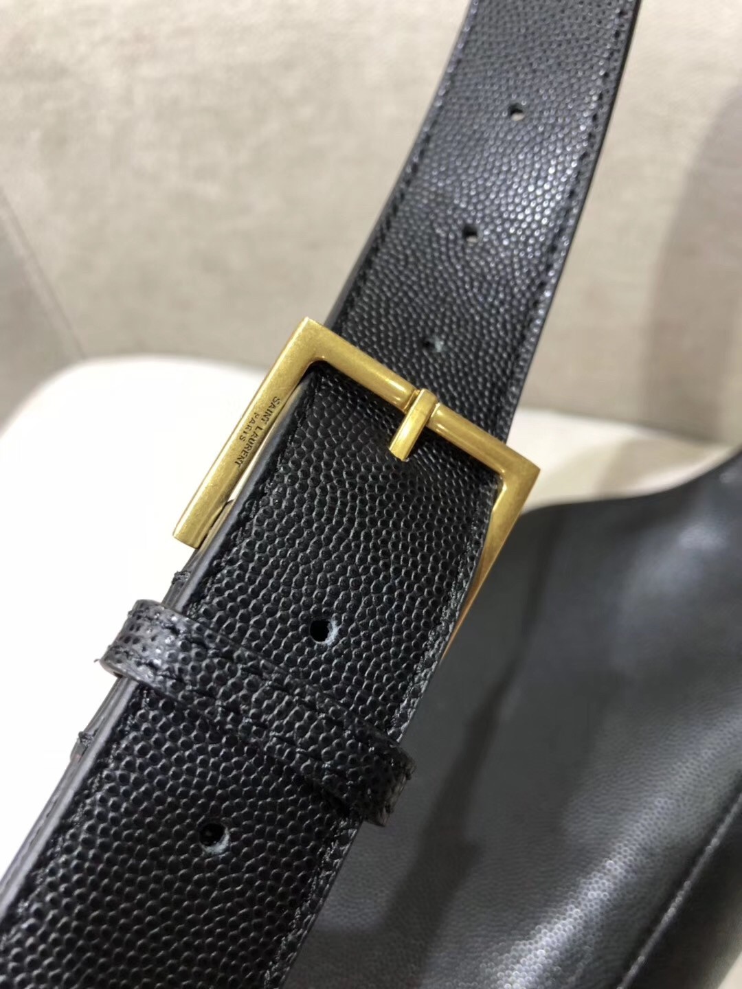 Sa**t Lau*nt classic monogram belt bag in black grained leather