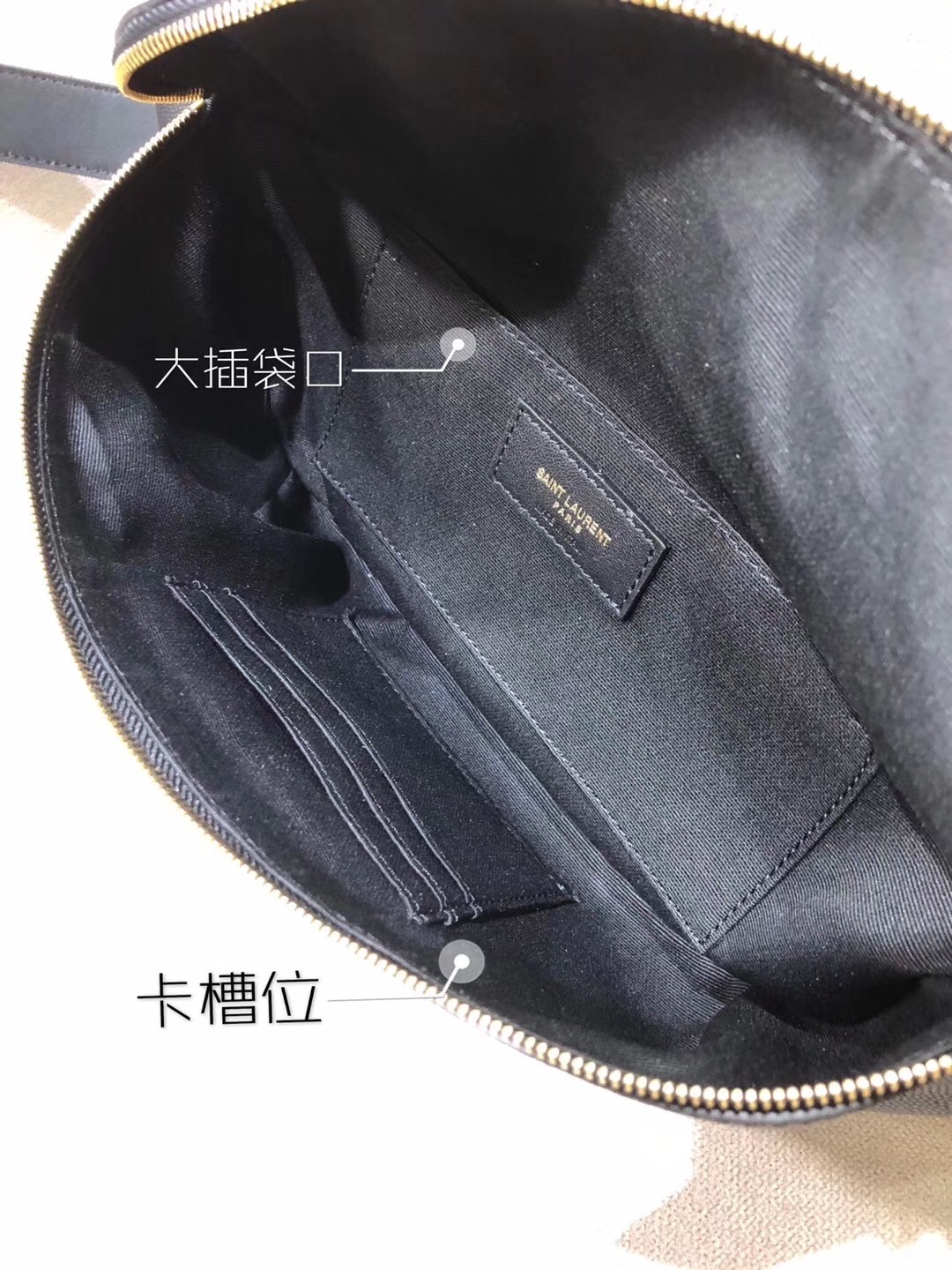 Sa**t Lau*nt classic monogram belt bag in black grained leather