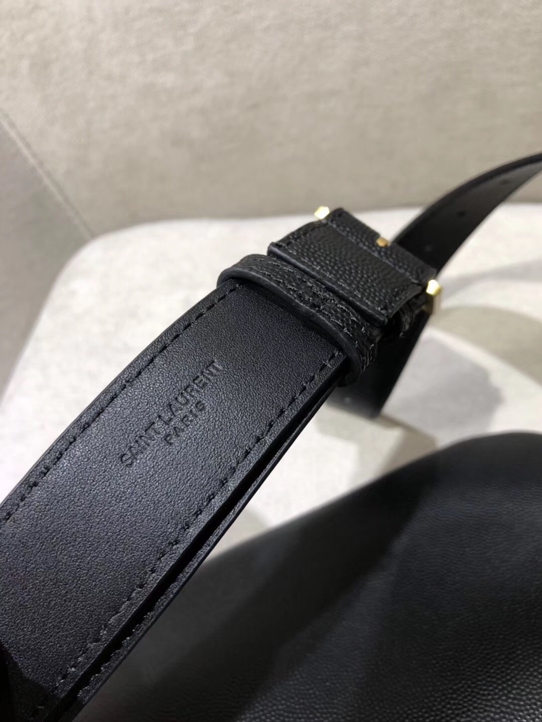 Sa**t Lau*nt classic monogram belt bag in black grained leather
