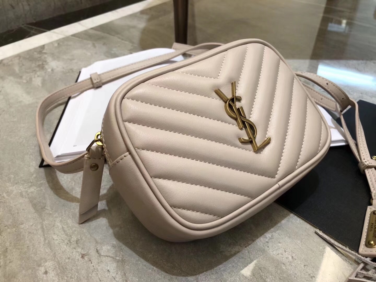 Sa**t Lau*nt lou belt bag in blanc matelasse leather