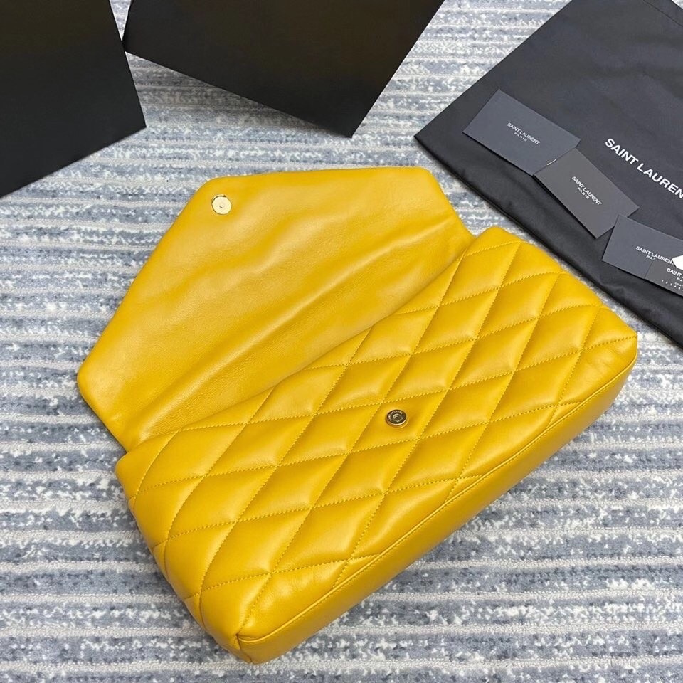 Sa**t Lau*nt sade puffer envelope clutch in yellow lambskin