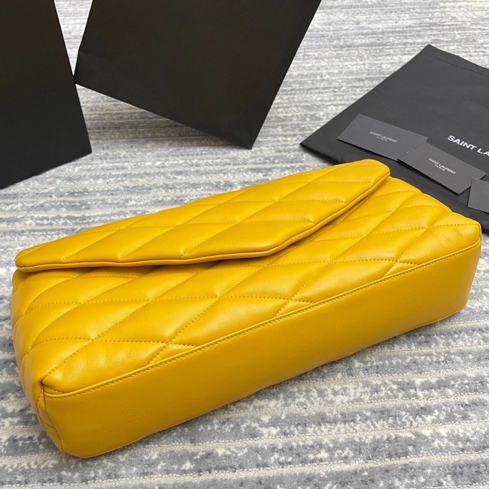 Sa**t Lau*nt sade puffer envelope clutch in yellow lambskin