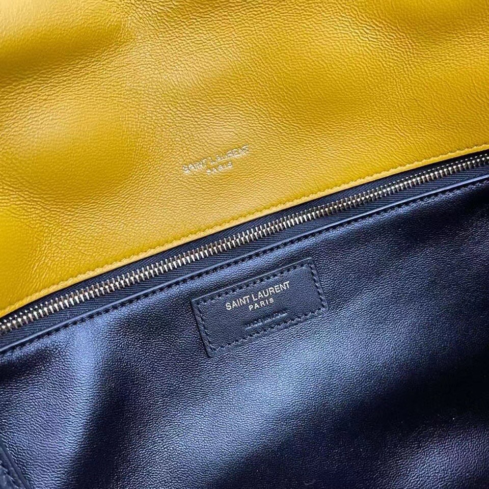 Sa**t Lau*nt sade puffer envelope clutch in yellow lambskin