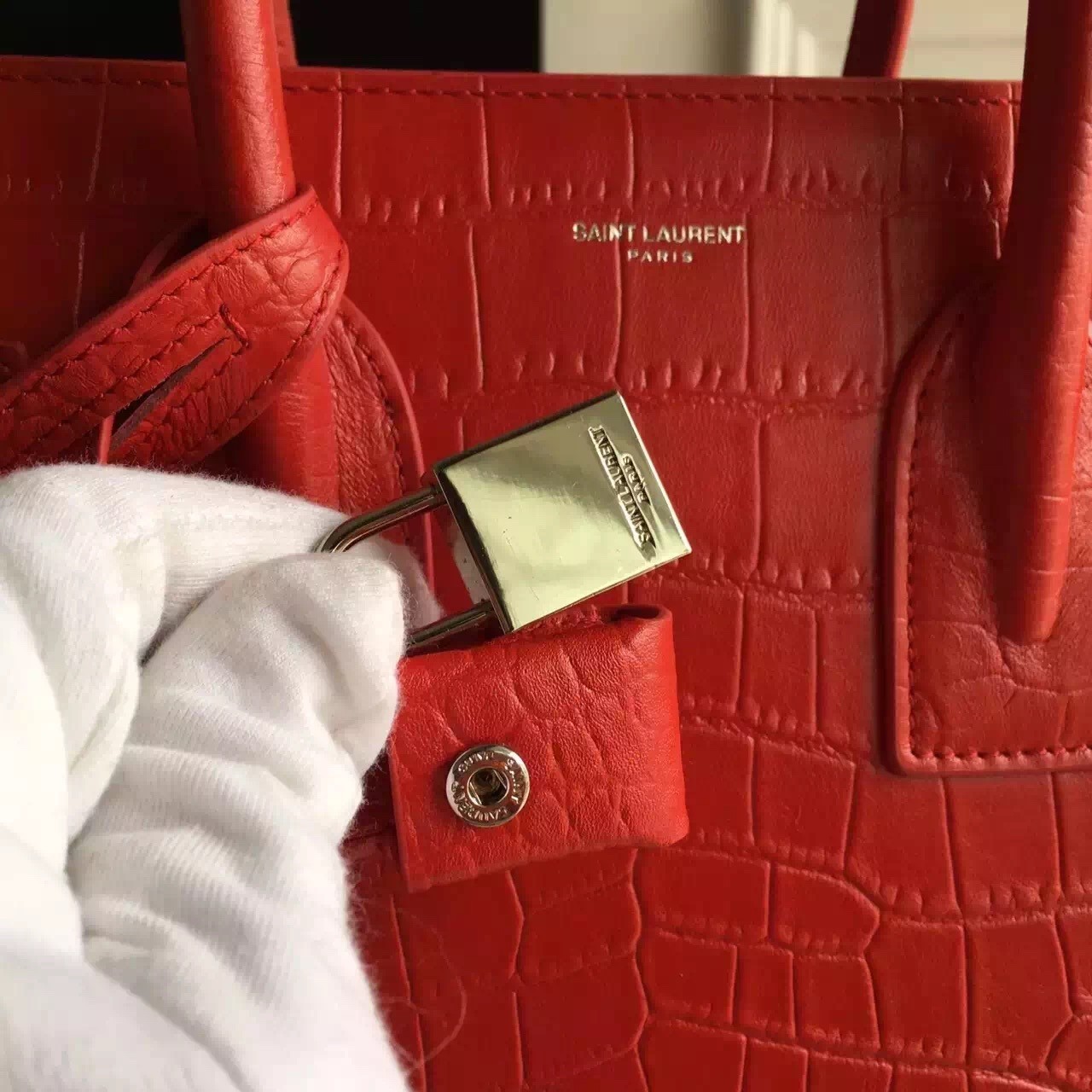 Sa**t Lau*nt small sac de jour bag in red crocodile leather