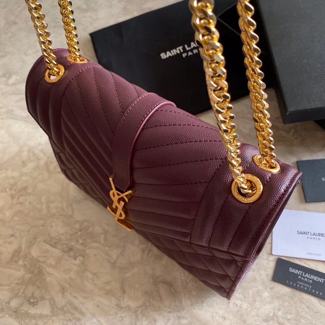 Sa**t Lau*nt medium envelope bag in bordeaux grained leather
